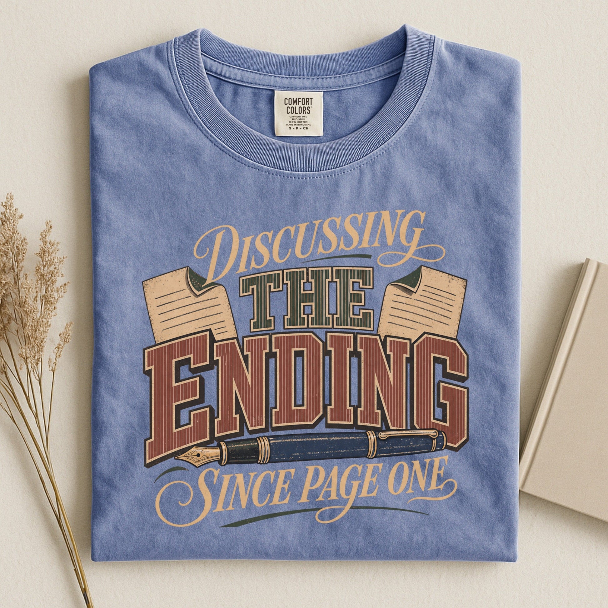 Discussing the Ending Since Page One bookish tee in Blue Jean, flat lay