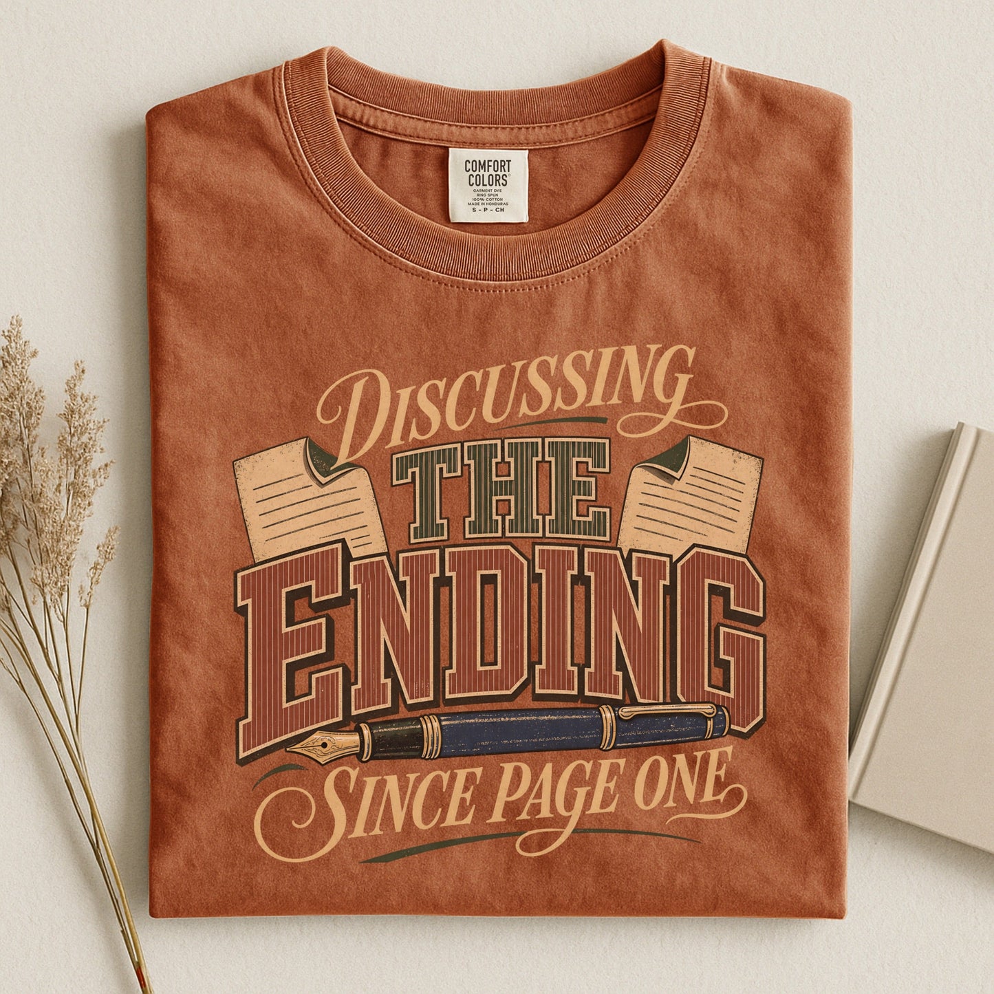 Discussing the Ending Since Page One bookish tee in Yam, flat lay
