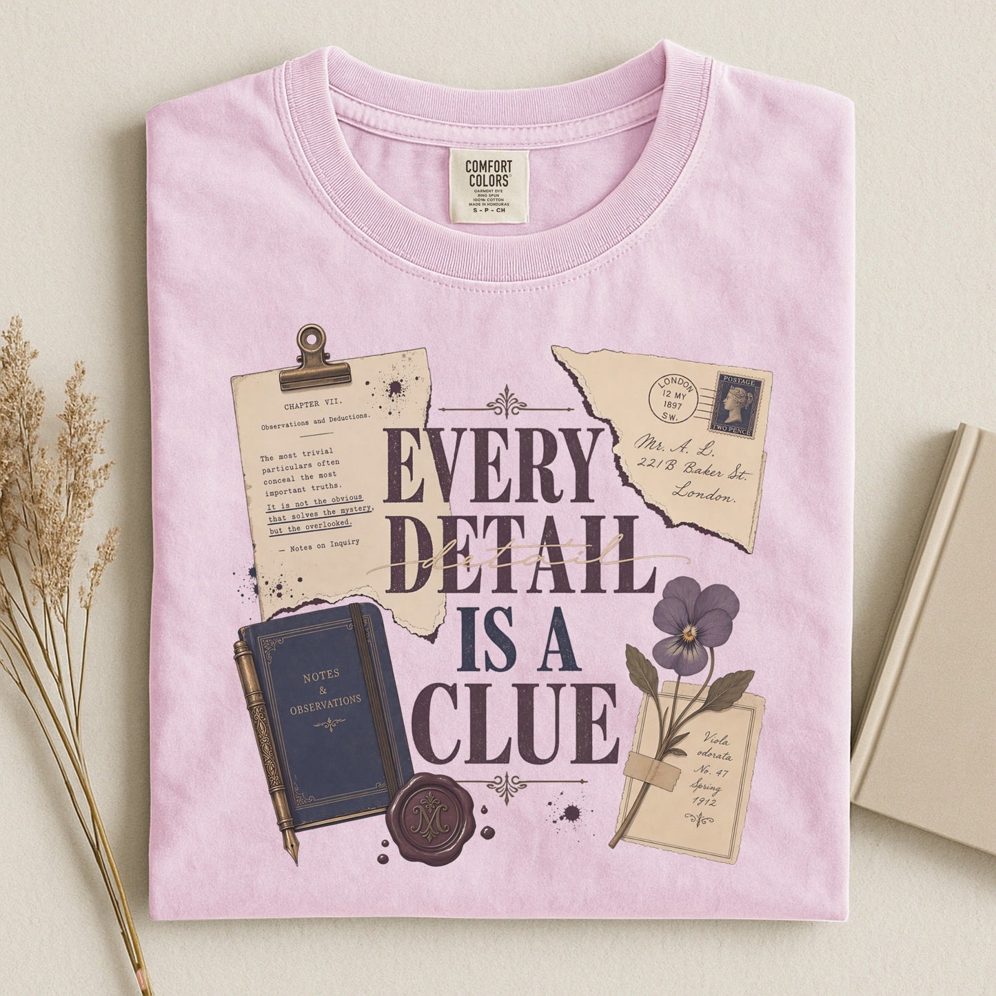 Every Detail Is a Clue bookish tee in Blossom, flat lay