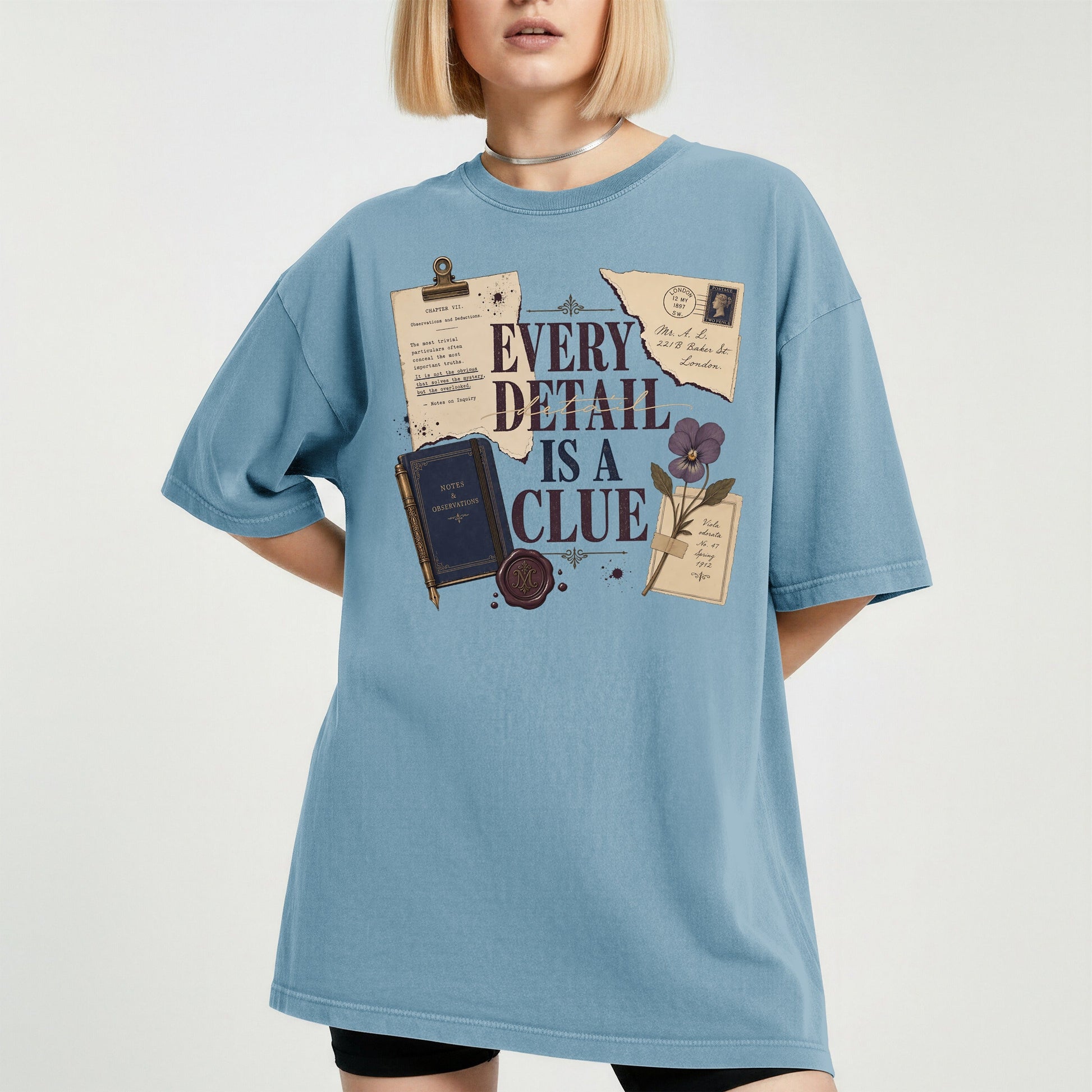 Every Detail Is a Clue bookish tee in Ice Blue, worn