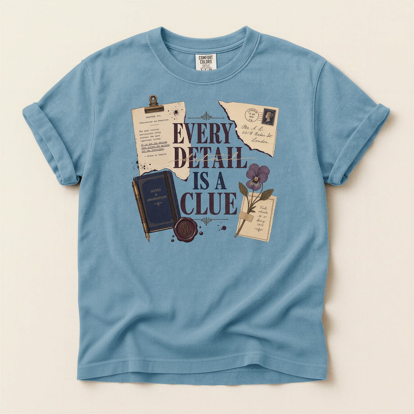 Every Detail Is a Clue bookish tee in Ice Blue, full flat