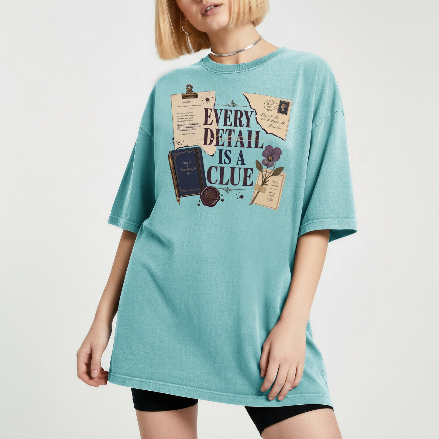 Every Detail Is a Clue bookish tee in Seafoam, worn