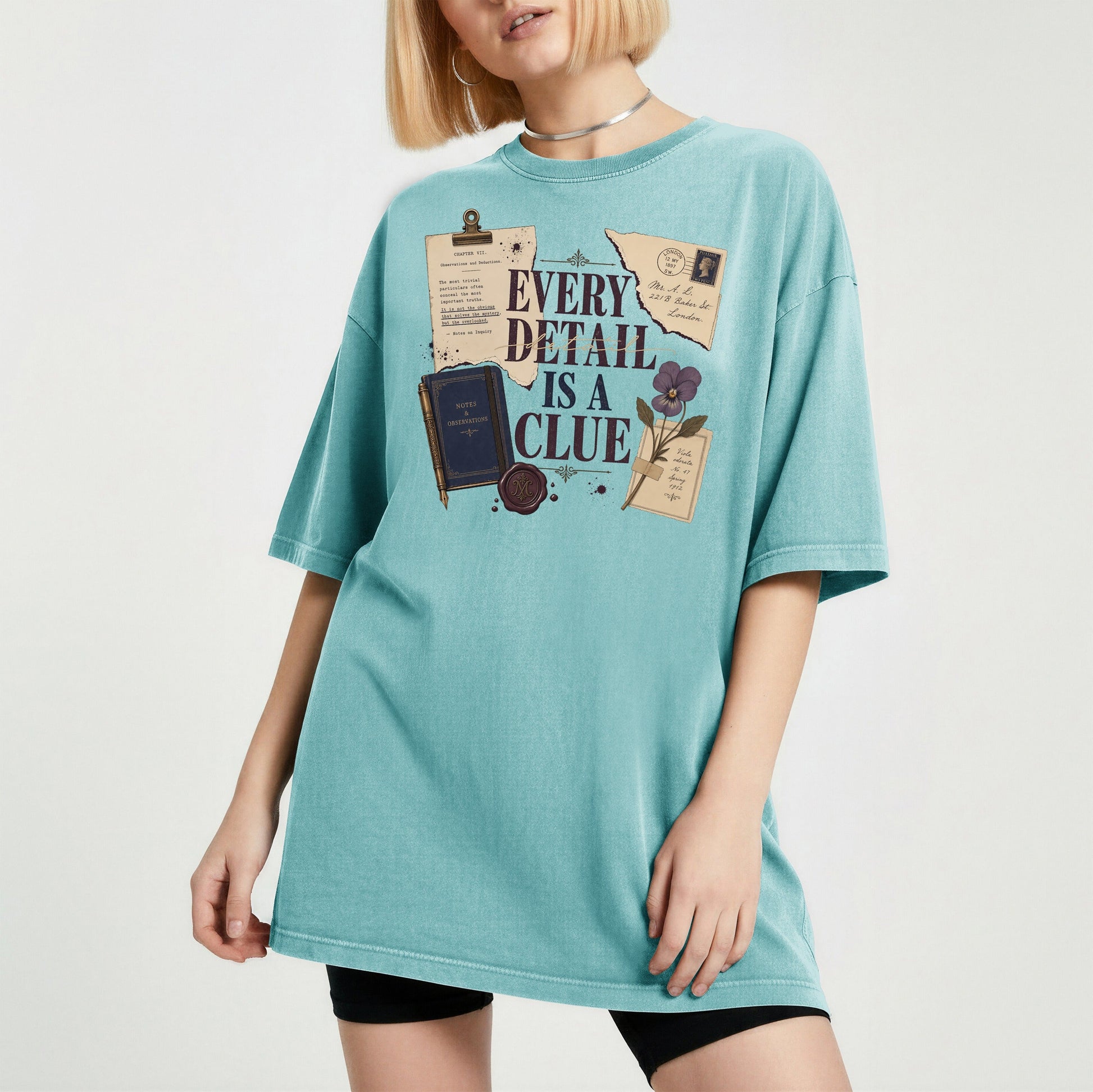 Every Detail Is a Clue bookish tee in Seafoam, worn