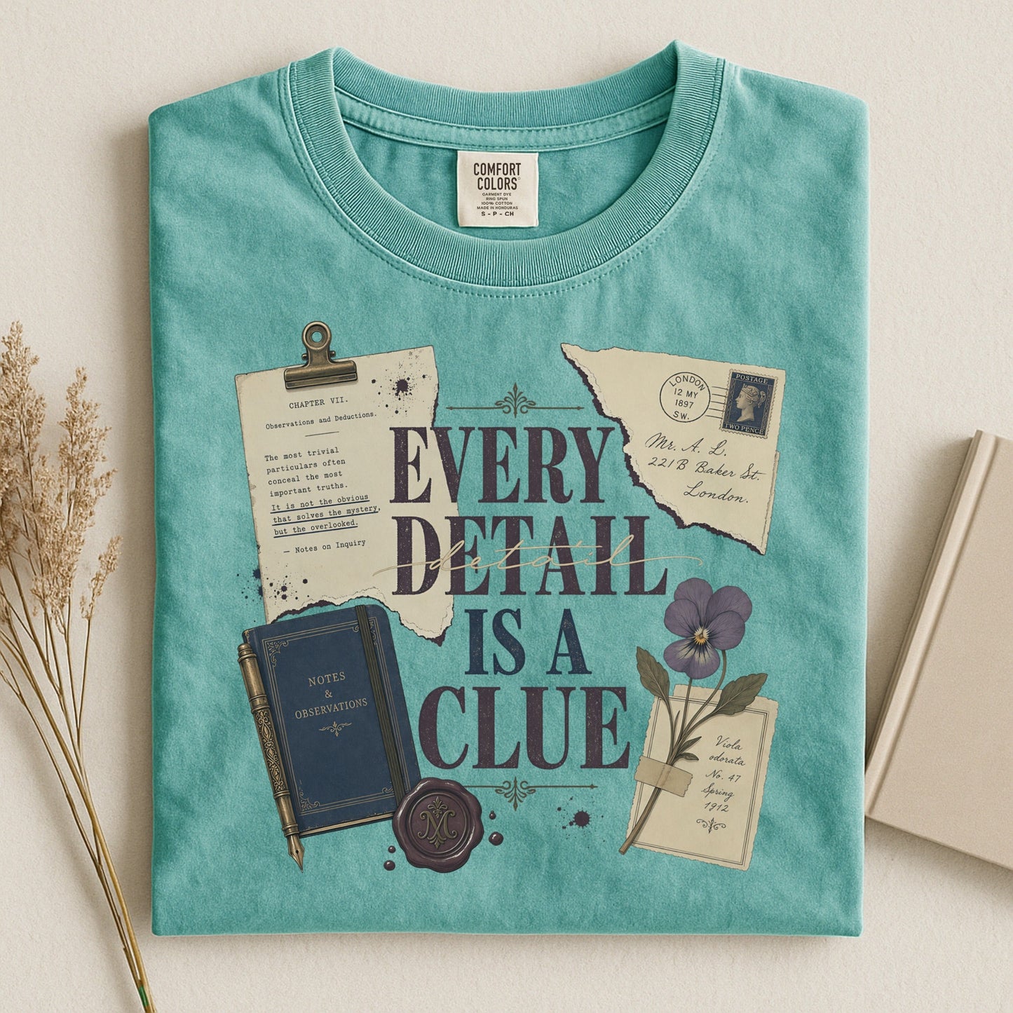 Every Detail Is a Clue bookish tee in Seafoam, flat lay