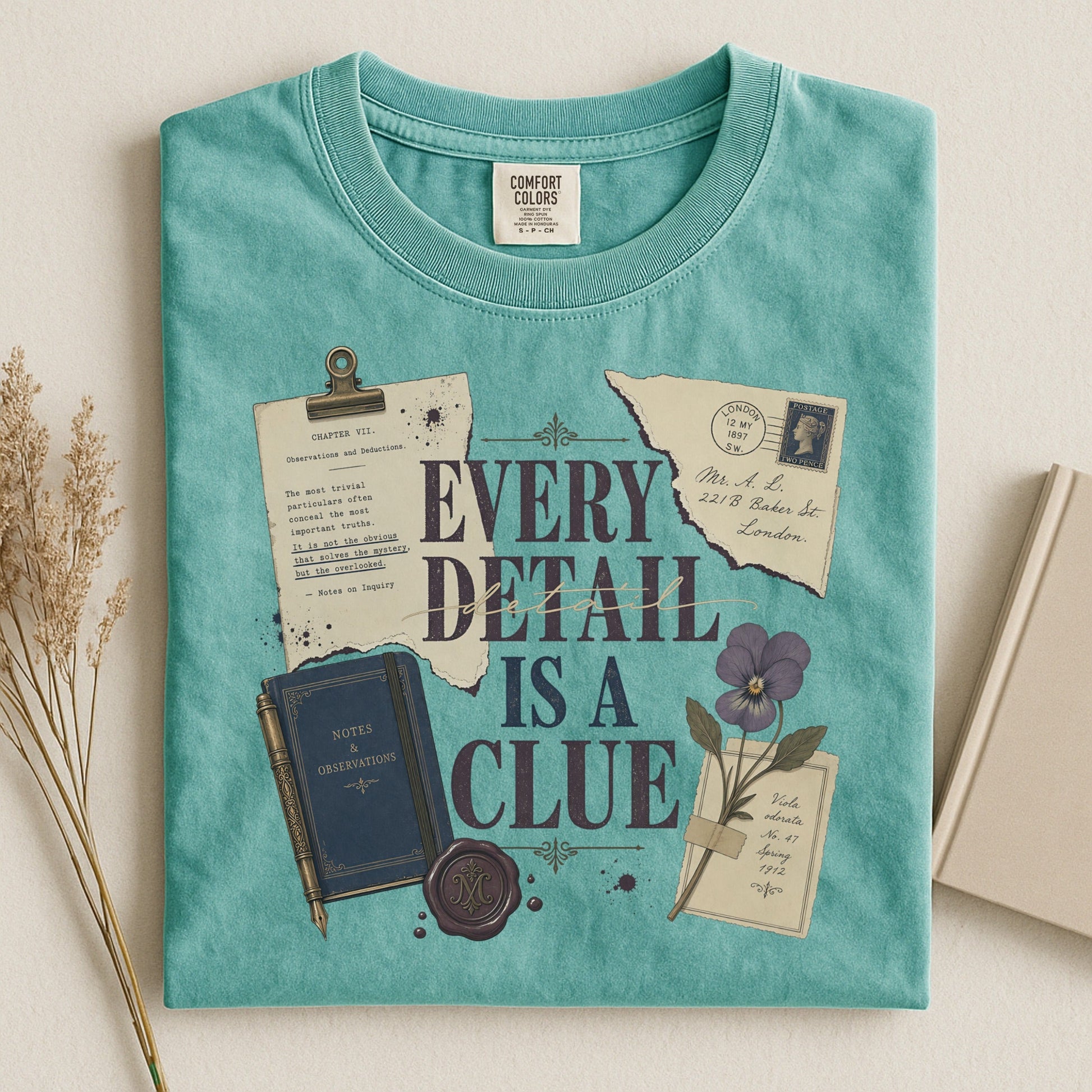 Every Detail Is a Clue bookish tee in Seafoam, flat lay