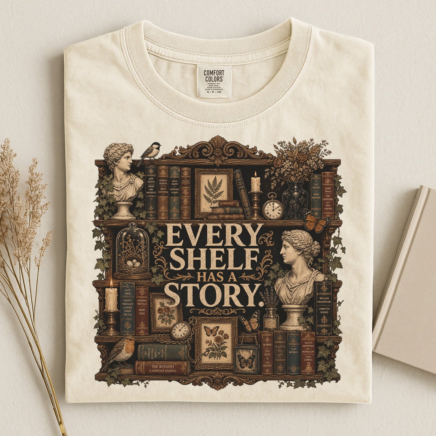Every Shelf Has a Story bookish tee in Ivory, flat lay
