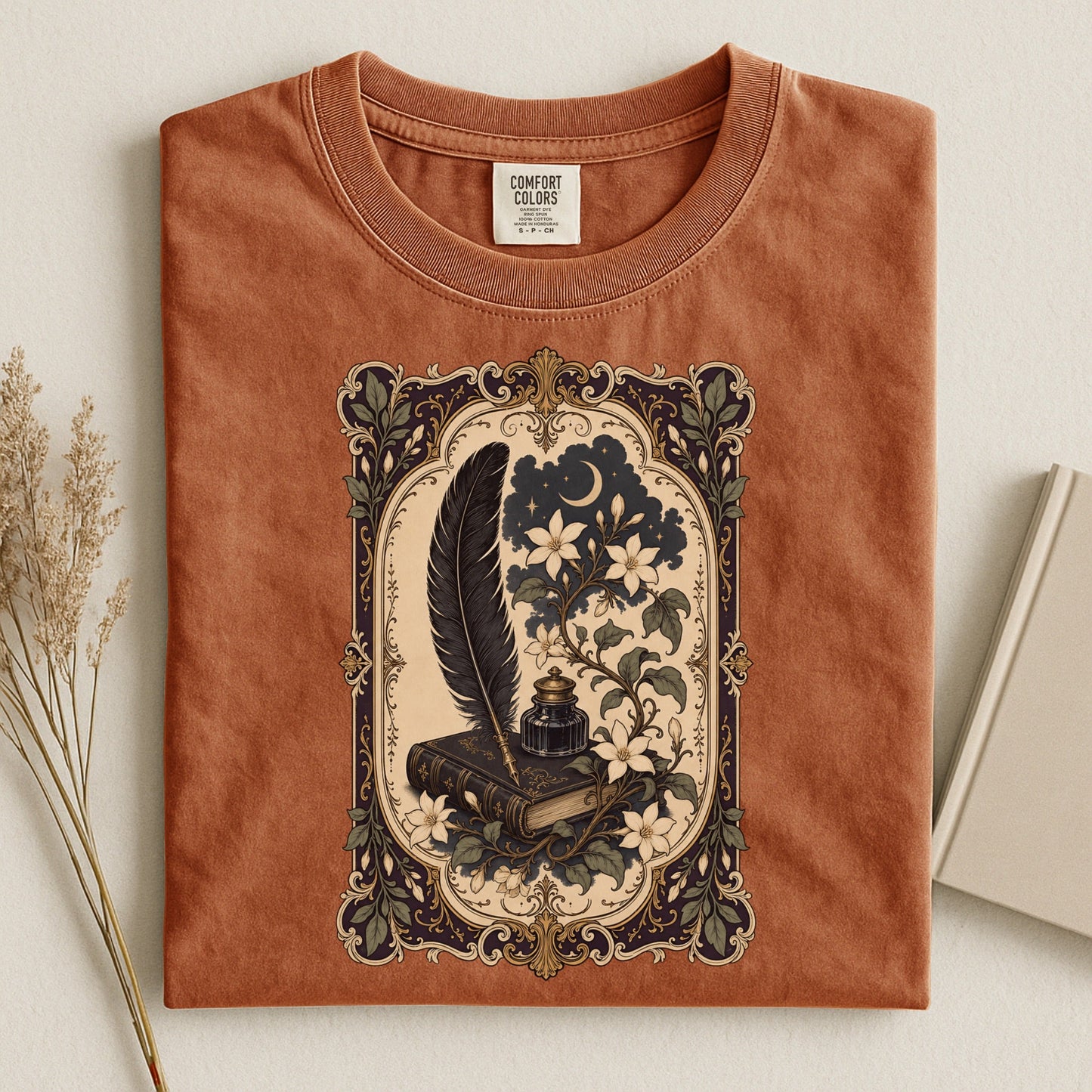 Feather & Wildflowers bookish tee in Yam, flat lay