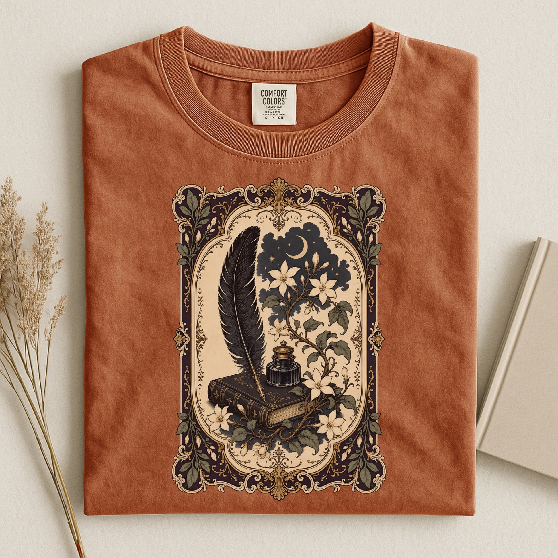 Feather & Wildflowers bookish tee in Yam, flat lay