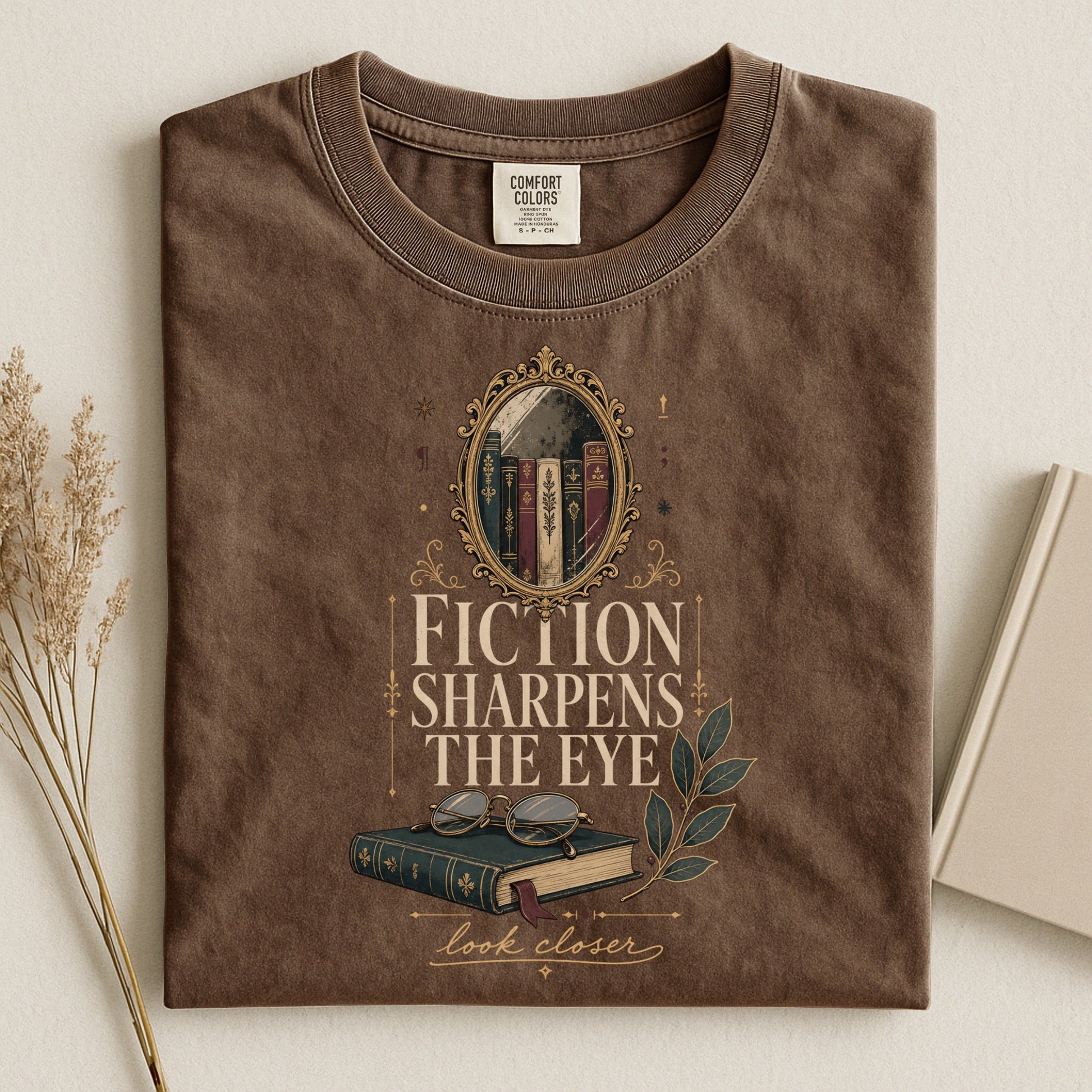 Fiction Sharpens the Eye bookish tee in Espresso, flat lay