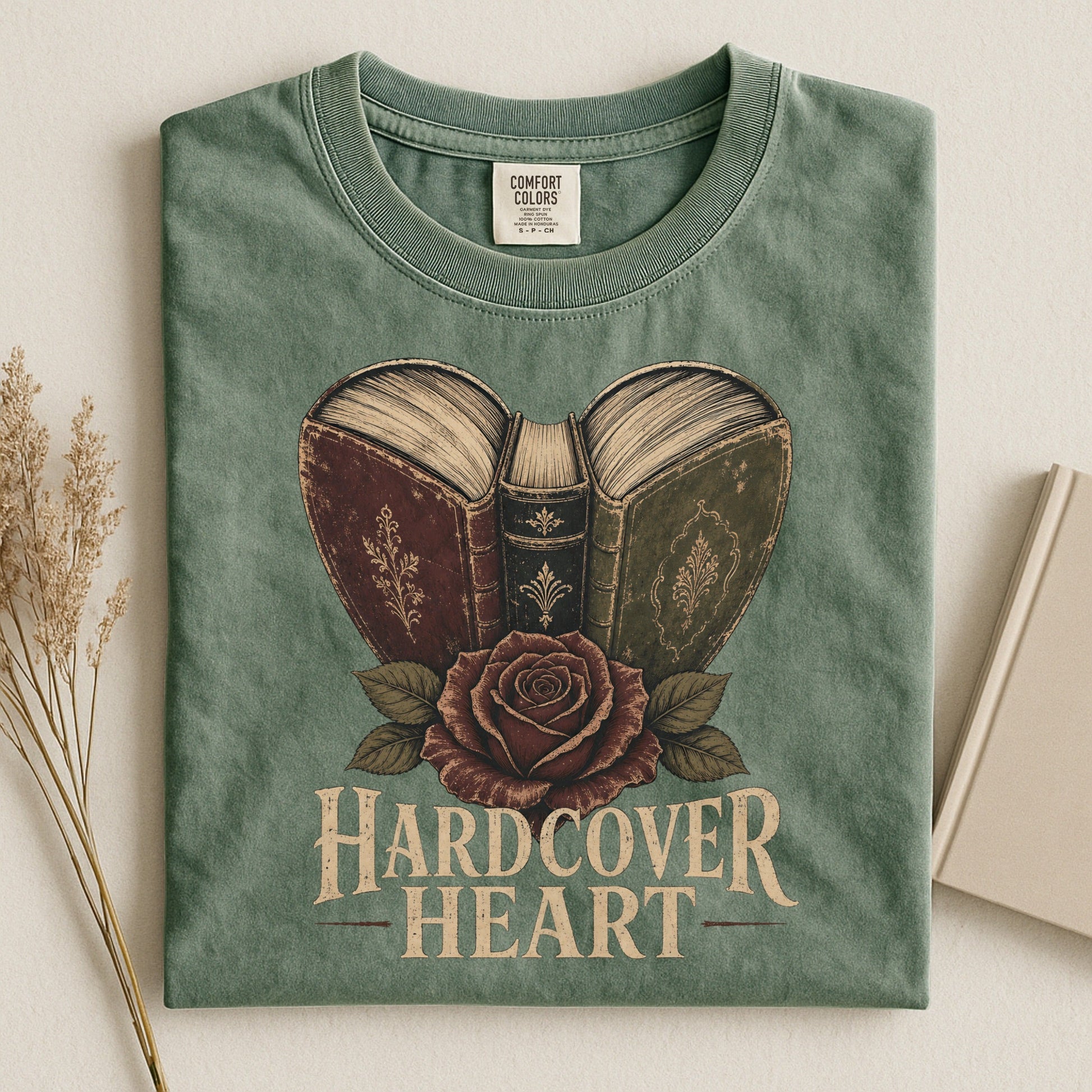 Shelf Love Studio Hardcover Heart t-shirt in Moss, styled flat lay
