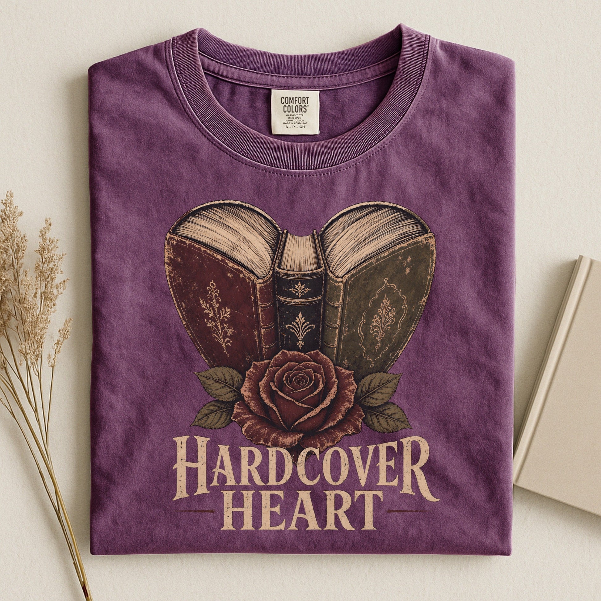 Shelf Love Studio Hardcover Heart t-shirt in Berry, styled flat lay