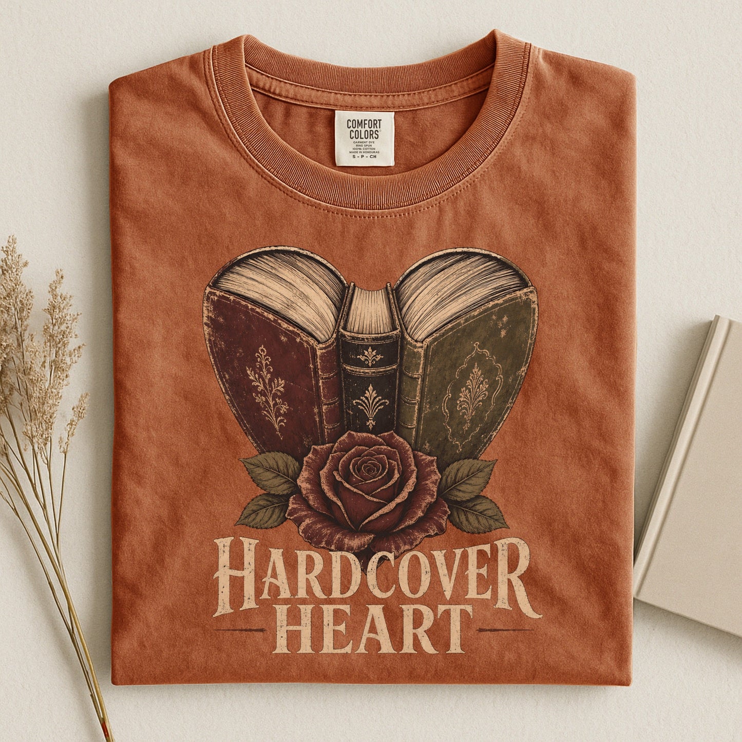 Shelf Love Studio Hardcover Heart t-shirt in Yam, styled flat lay