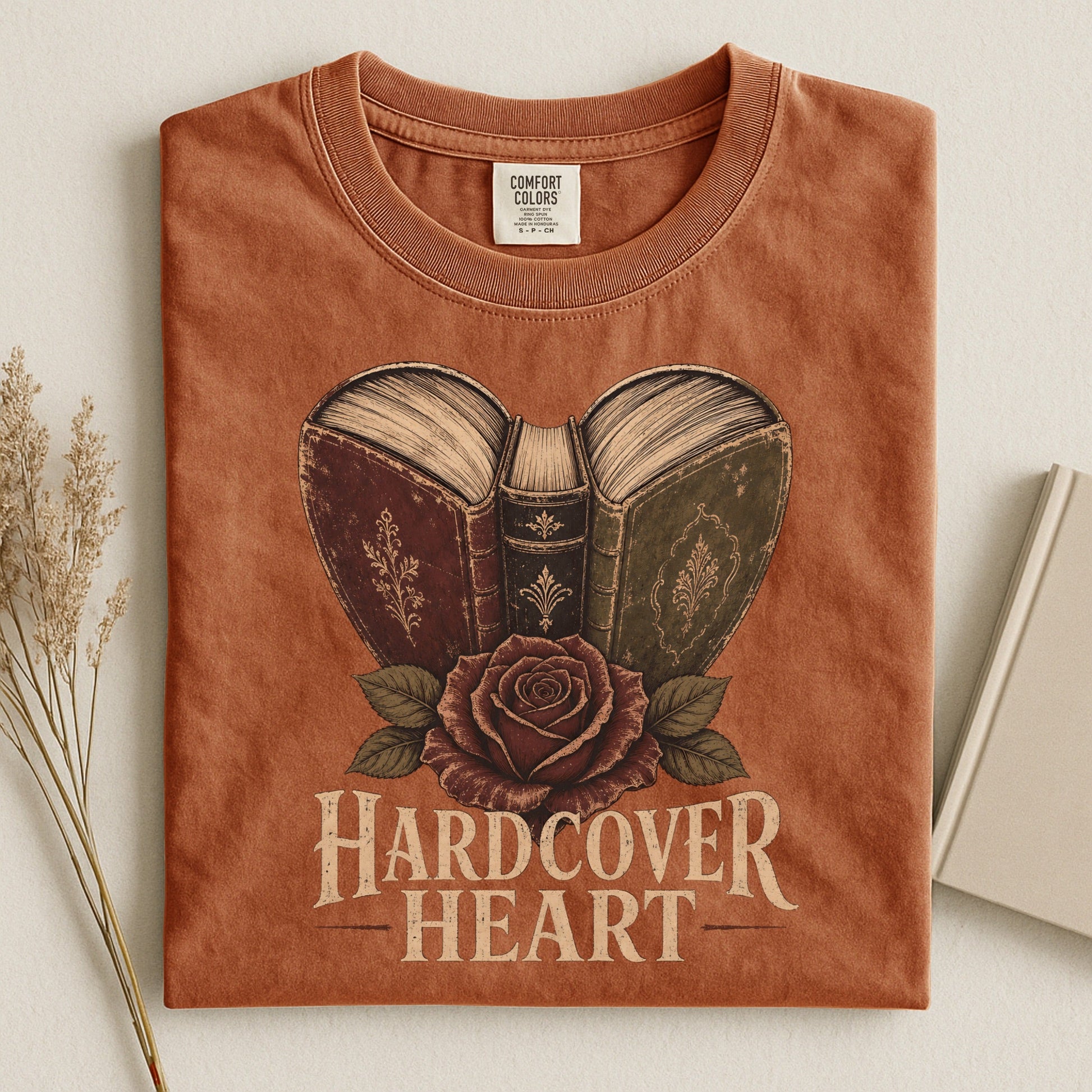 Shelf Love Studio Hardcover Heart t-shirt in Yam, styled flat lay