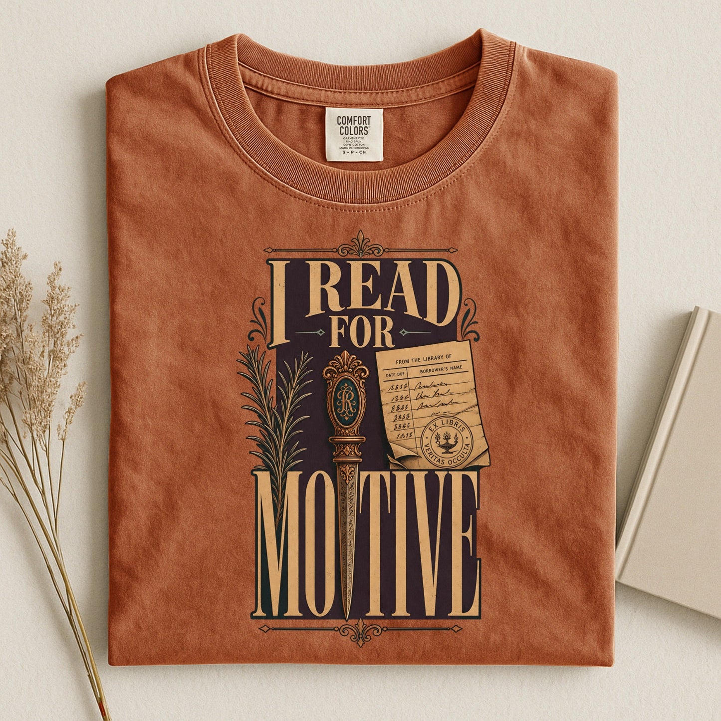 I Read for Motive bookish tee in Yam, flat lay