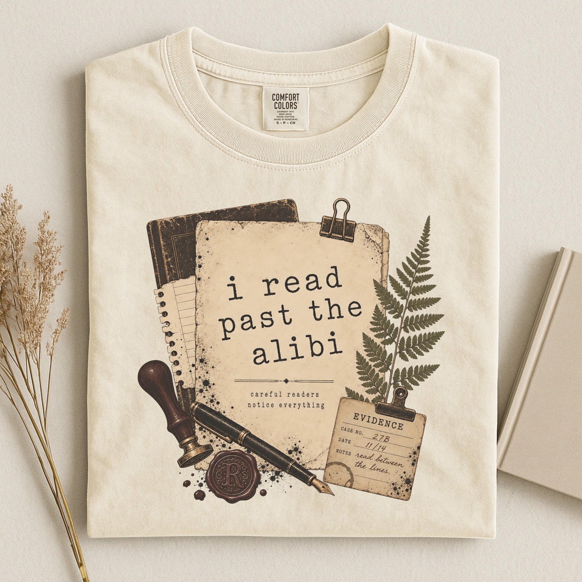 I Read Past the Alibi bookish tee in Ivory, flat lay