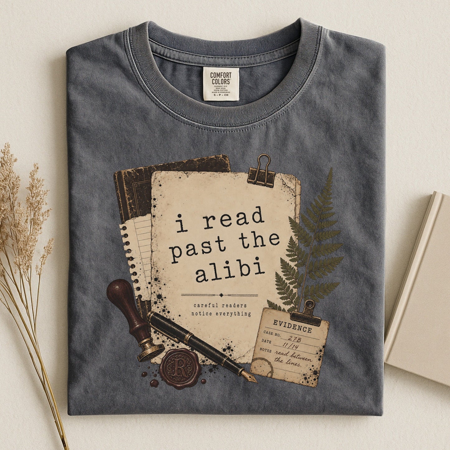I Read Past the Alibi bookish tee in Pepper, flat lay