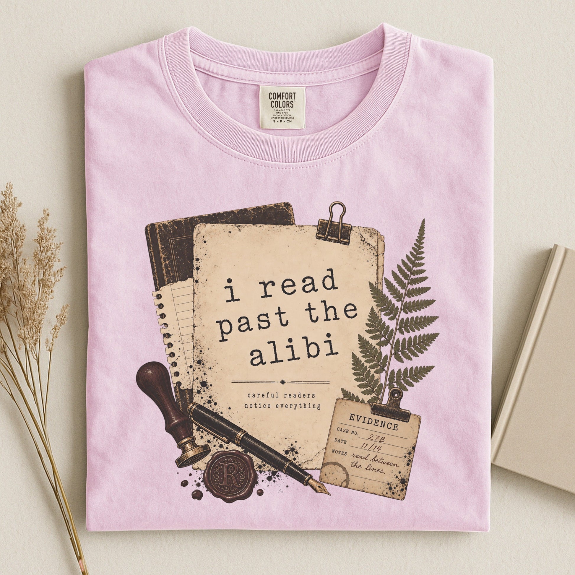 I Read Past the Alibi bookish tee in Blossom, flat lay