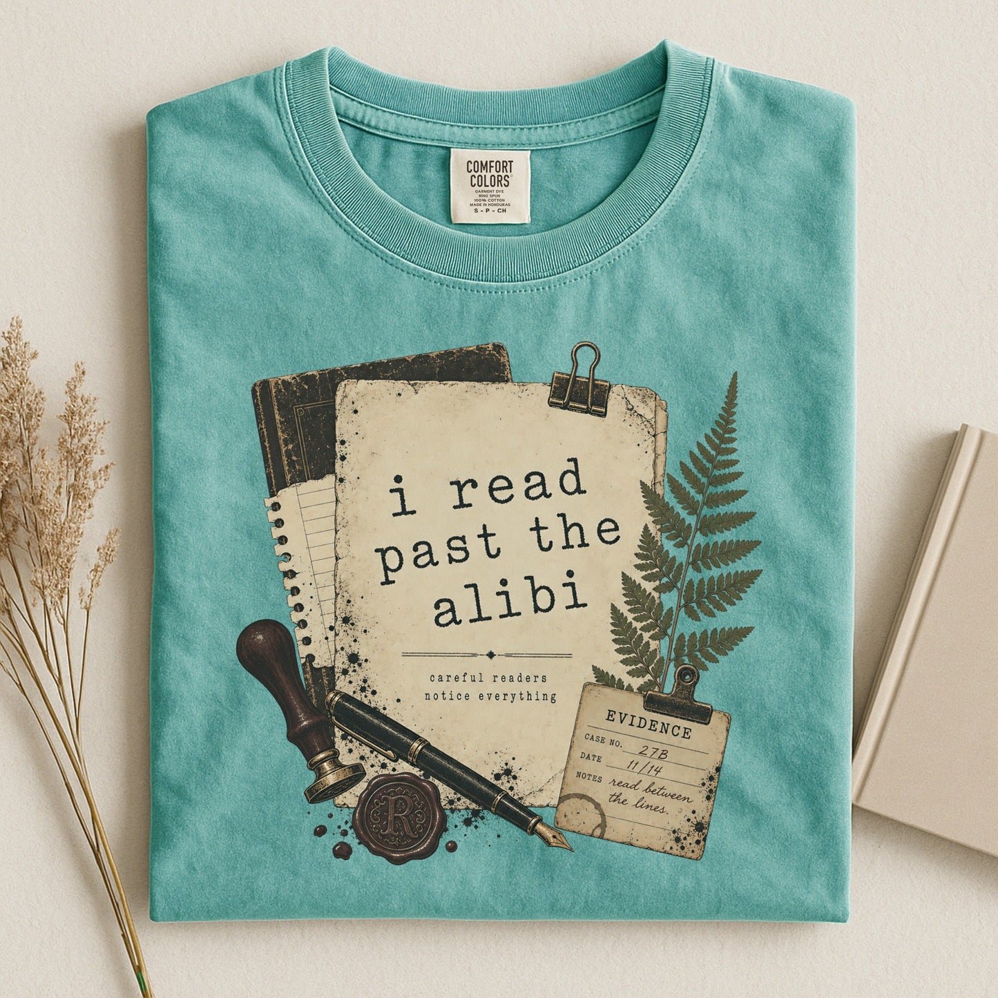 I Read Past the Alibi bookish tee in Seafoam, flat lay