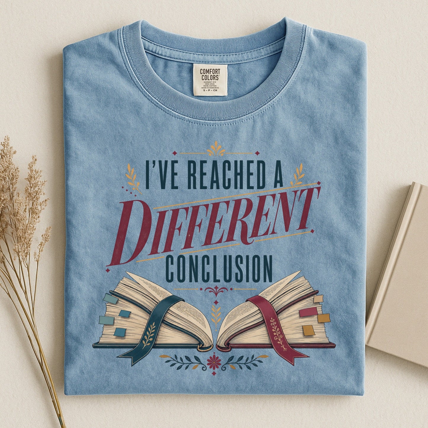 I've Reached a Different Conclusion bookish tee in Ice Blue, flat lay