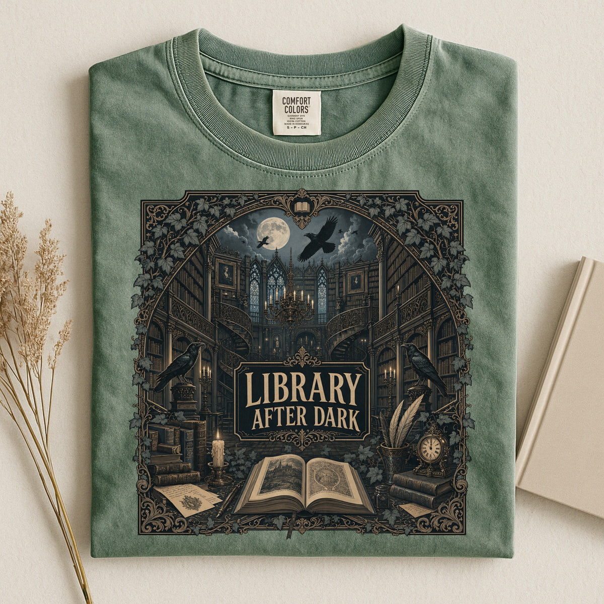 Library After Dark bookish tee in Moss, flat lay