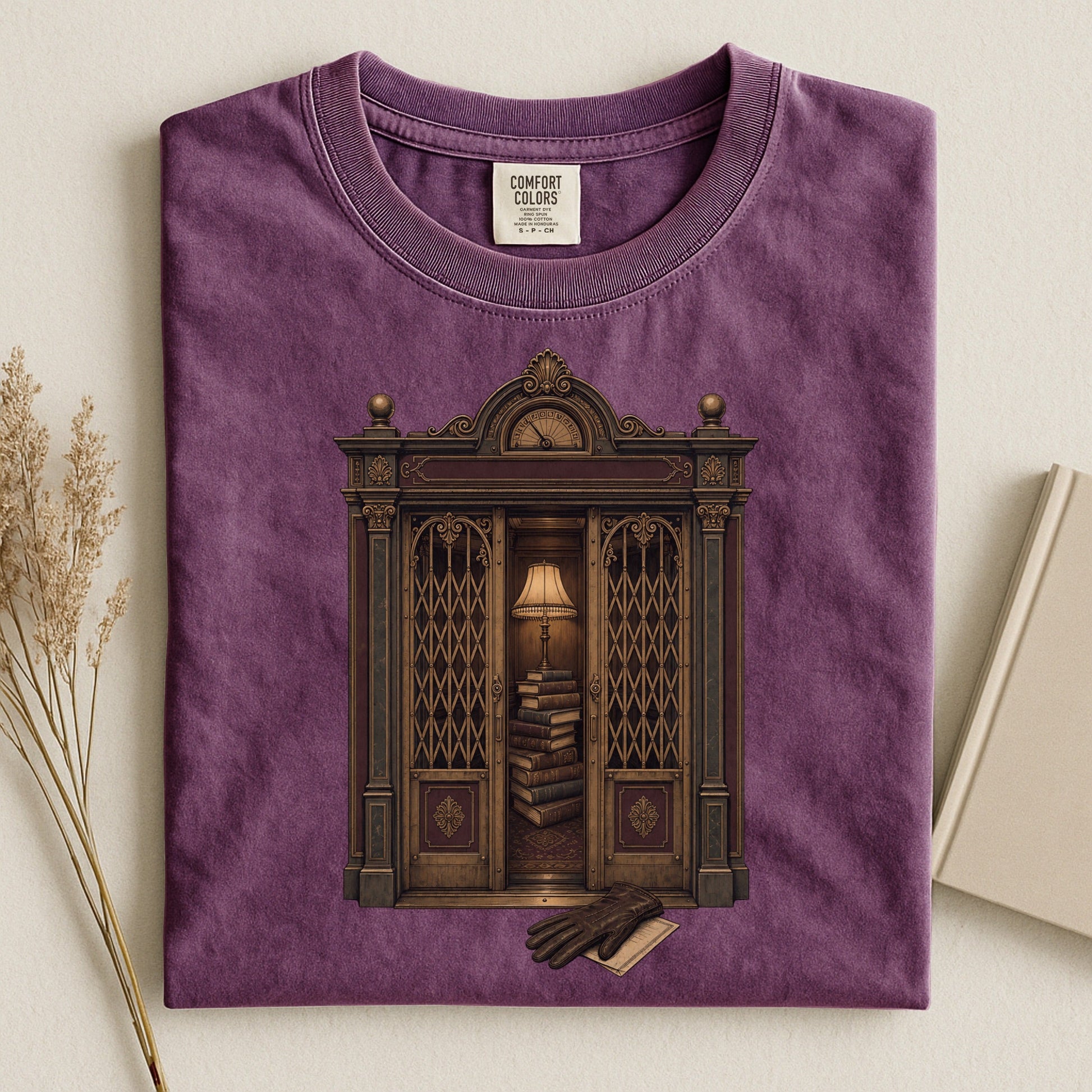 Library Alcove bookish tee in Berry, flat lay