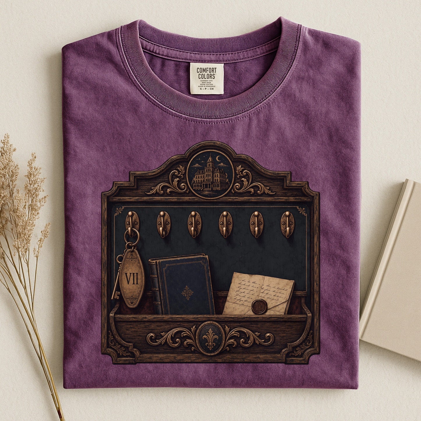 Library Key Board bookish tee in Berry, flat lay