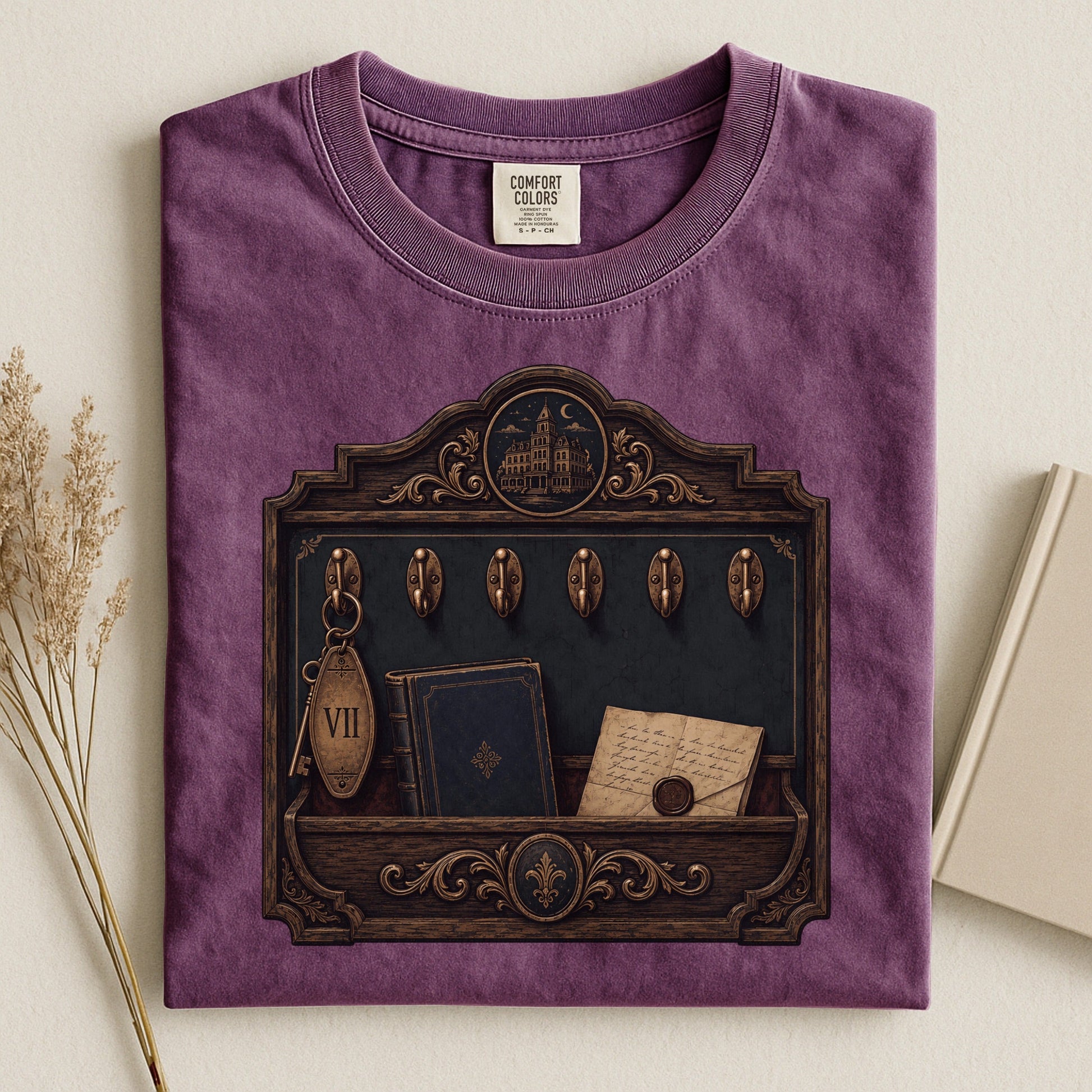 Library Key Board bookish tee in Berry, flat lay