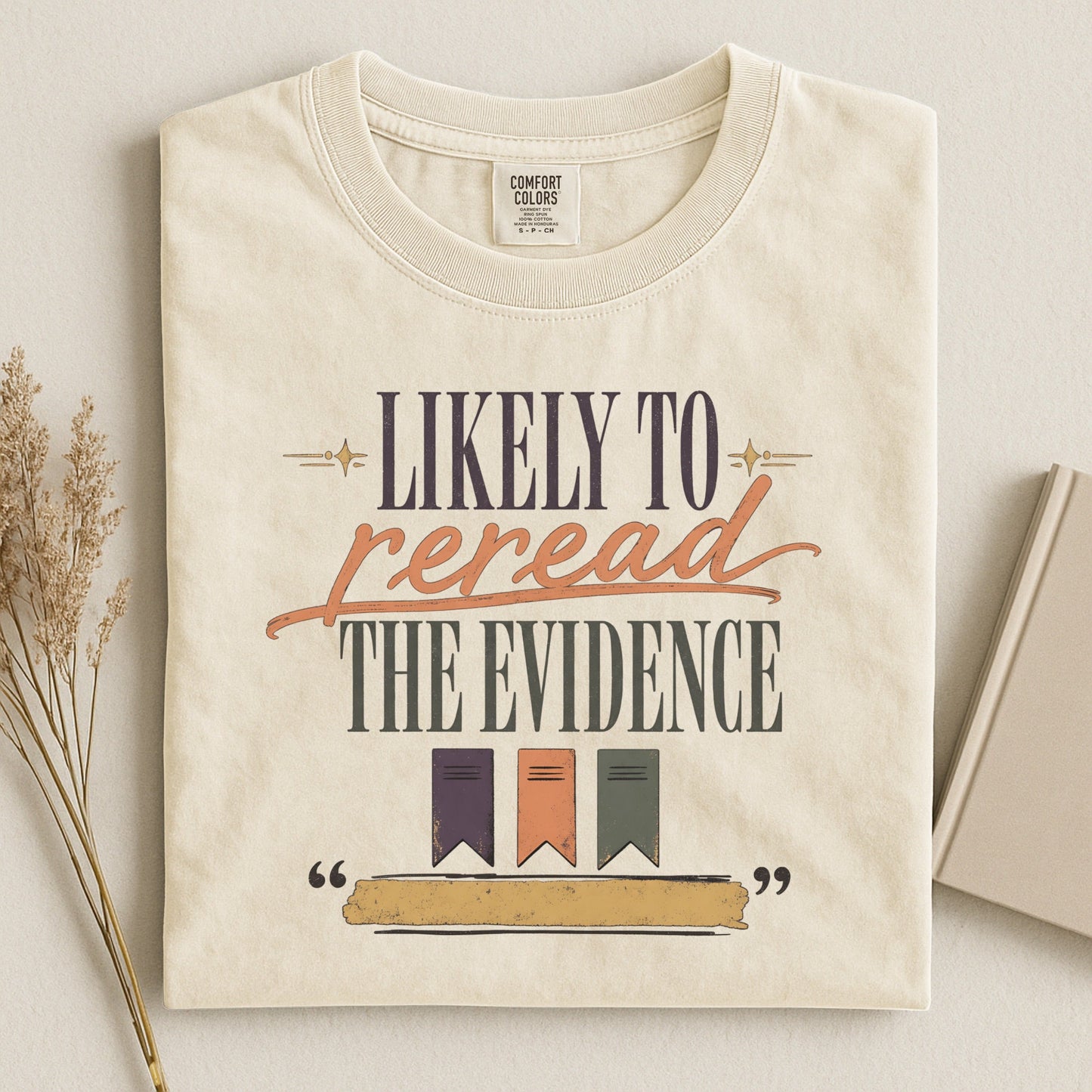 Likely to Reread the Evidence bookish tee in Ivory, flat lay