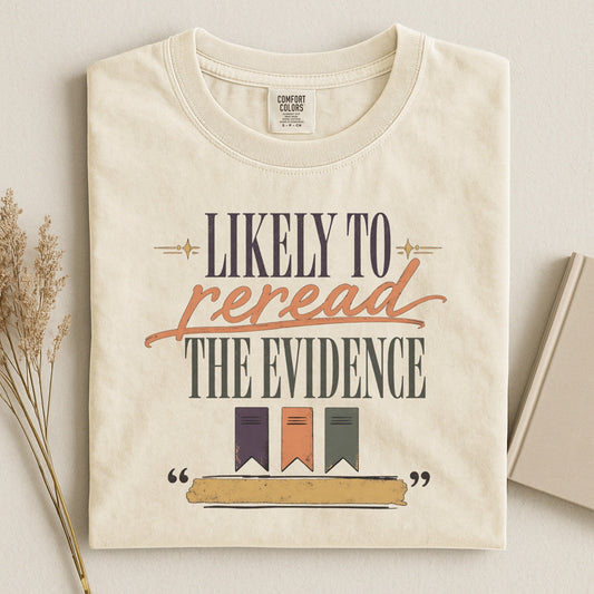 Likely to Reread the Evidence bookish tee in Ivory, flat lay