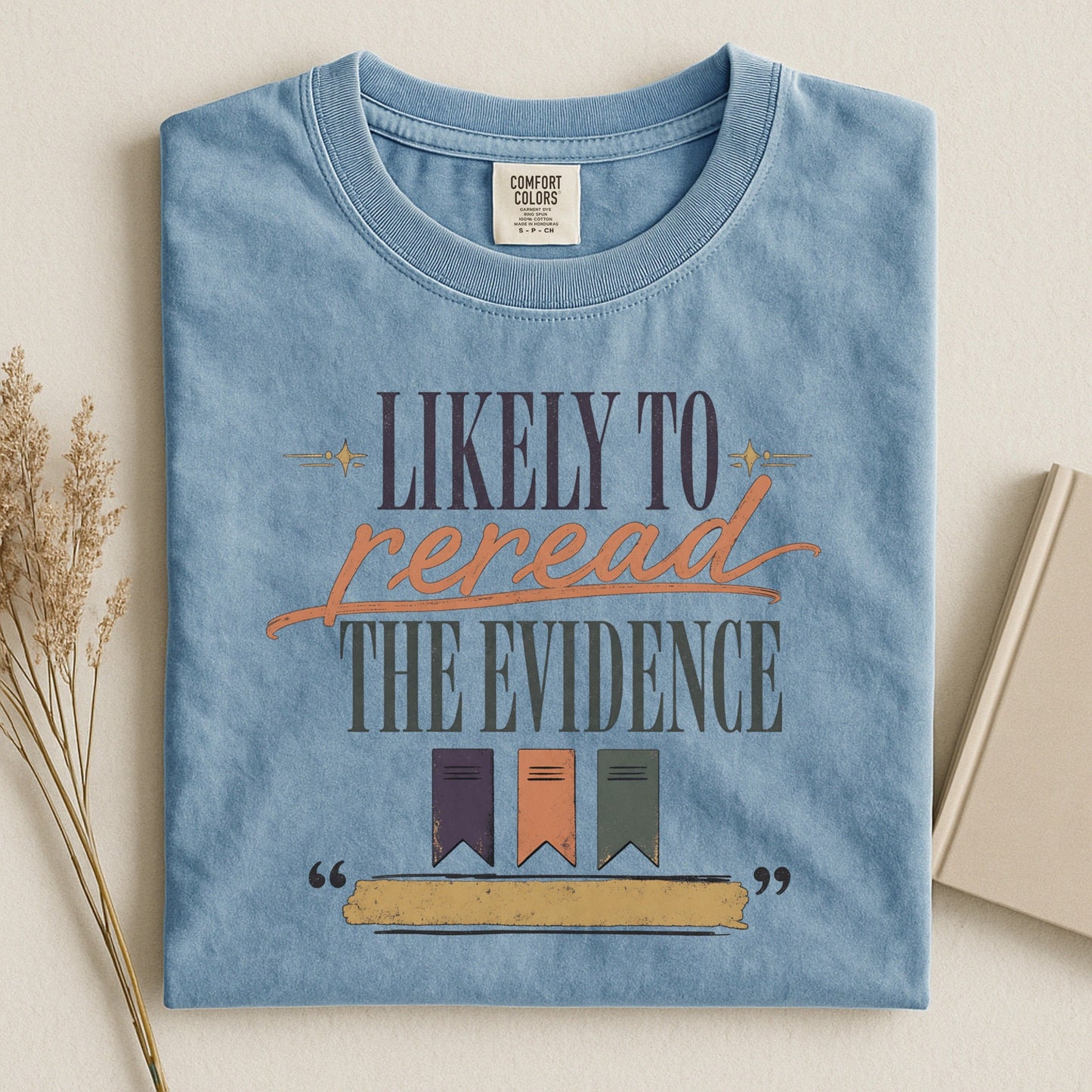 Likely to Reread the Evidence bookish tee in Ice Blue, flat lay