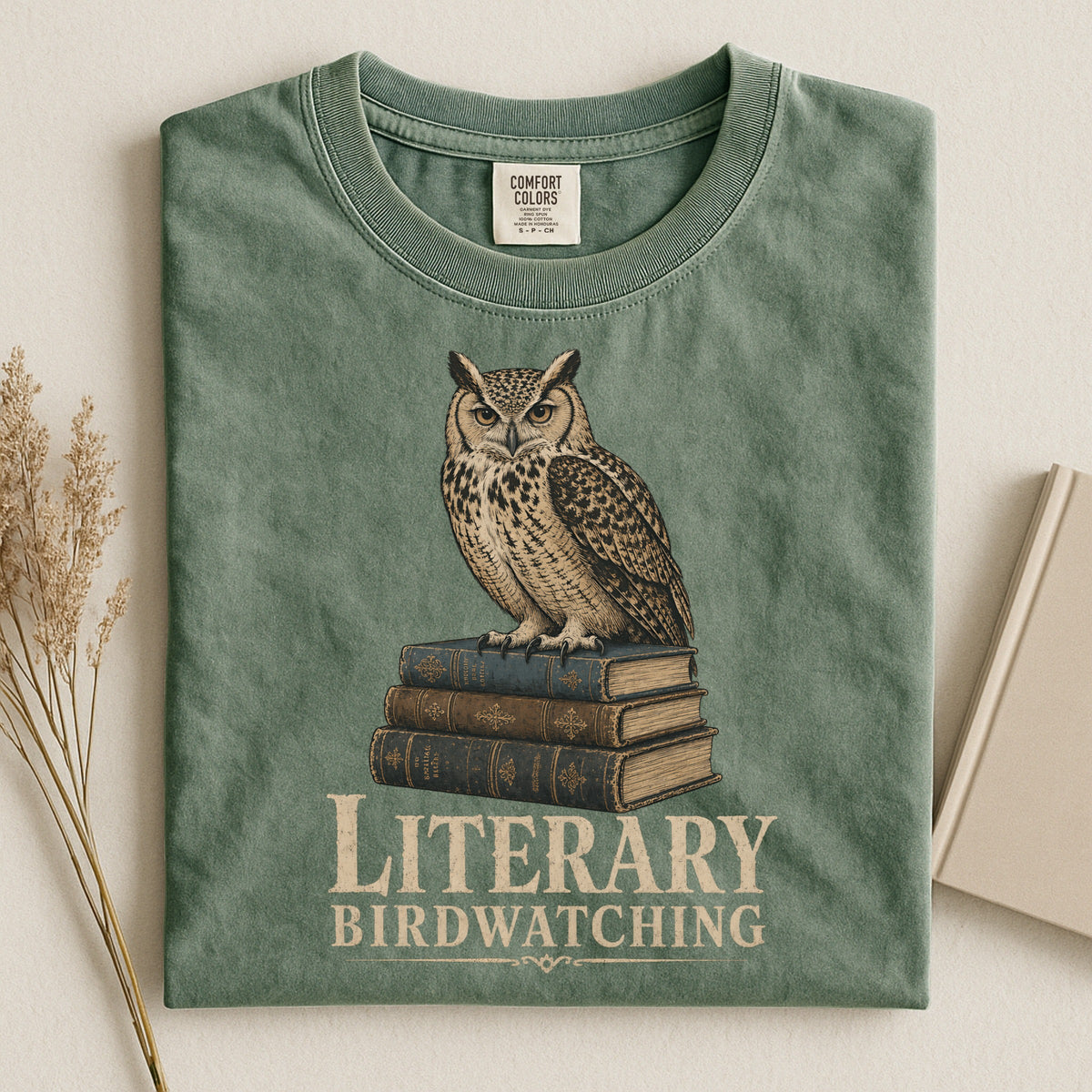 Shelf Love Studio Literary Birdwatching t-shirt in Moss, styled flat lay