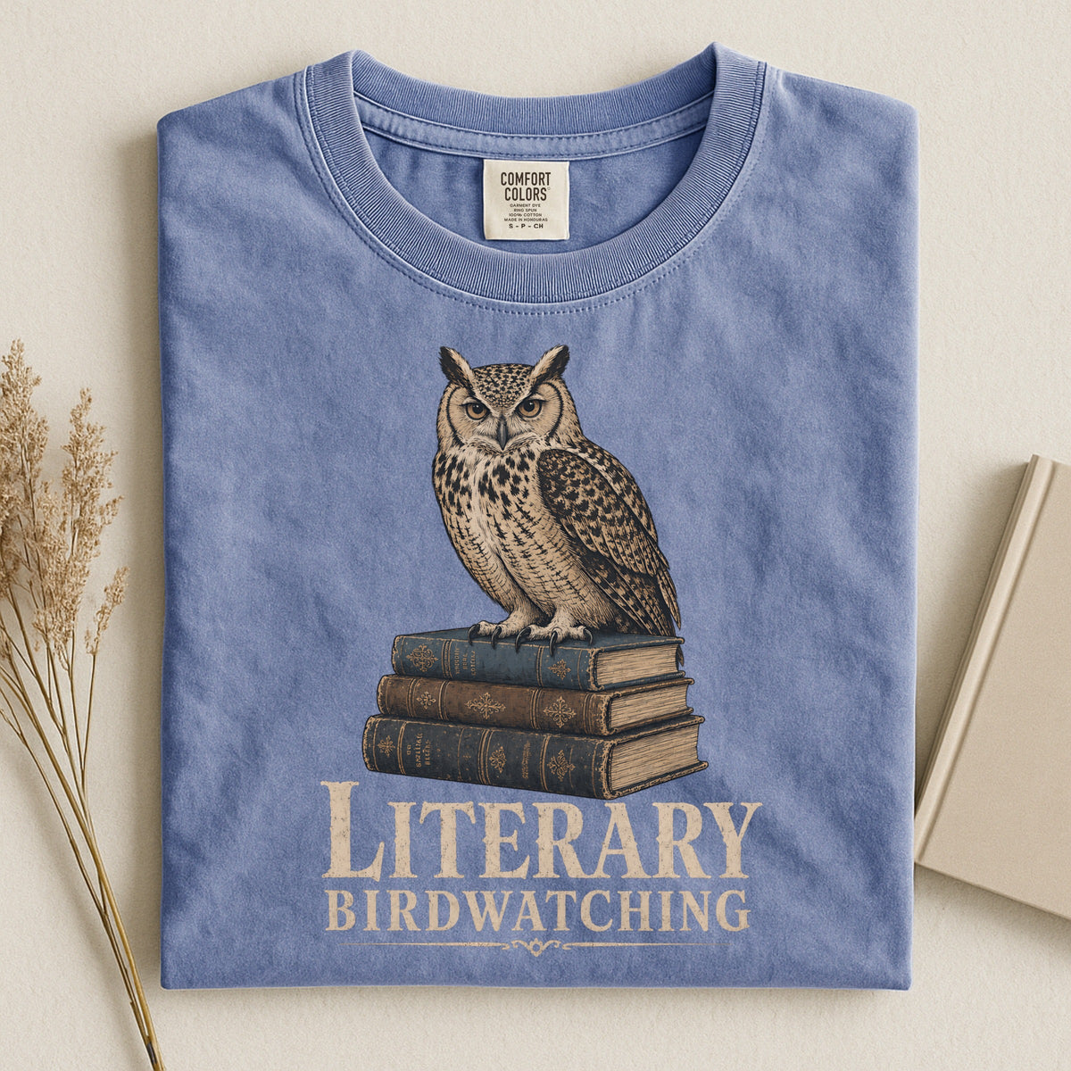 Shelf Love Studio Literary Birdwatching t-shirt in Blue Jean, styled flat lay