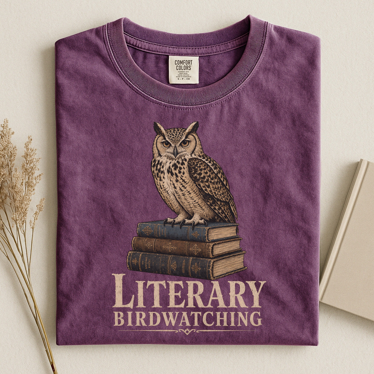 Shelf Love Studio Literary Birdwatching t-shirt in Berry, styled flat lay