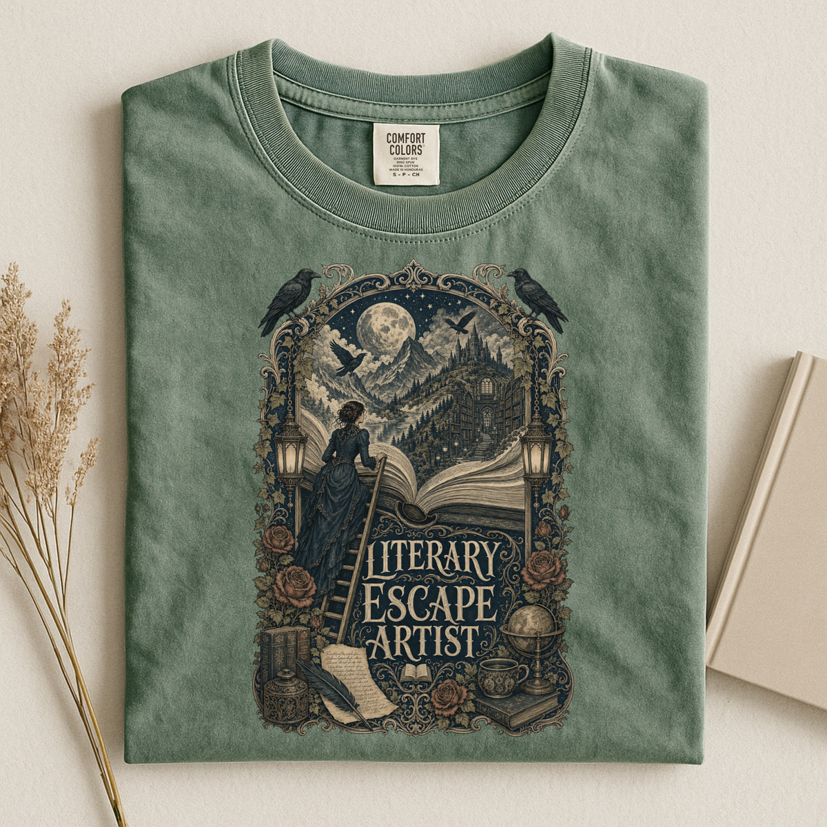 Literary Escape Artist bookish tee in Moss, flat lay