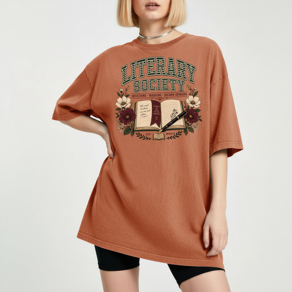 Shelf Love Studio Literary Society t-shirt in Yam, worn