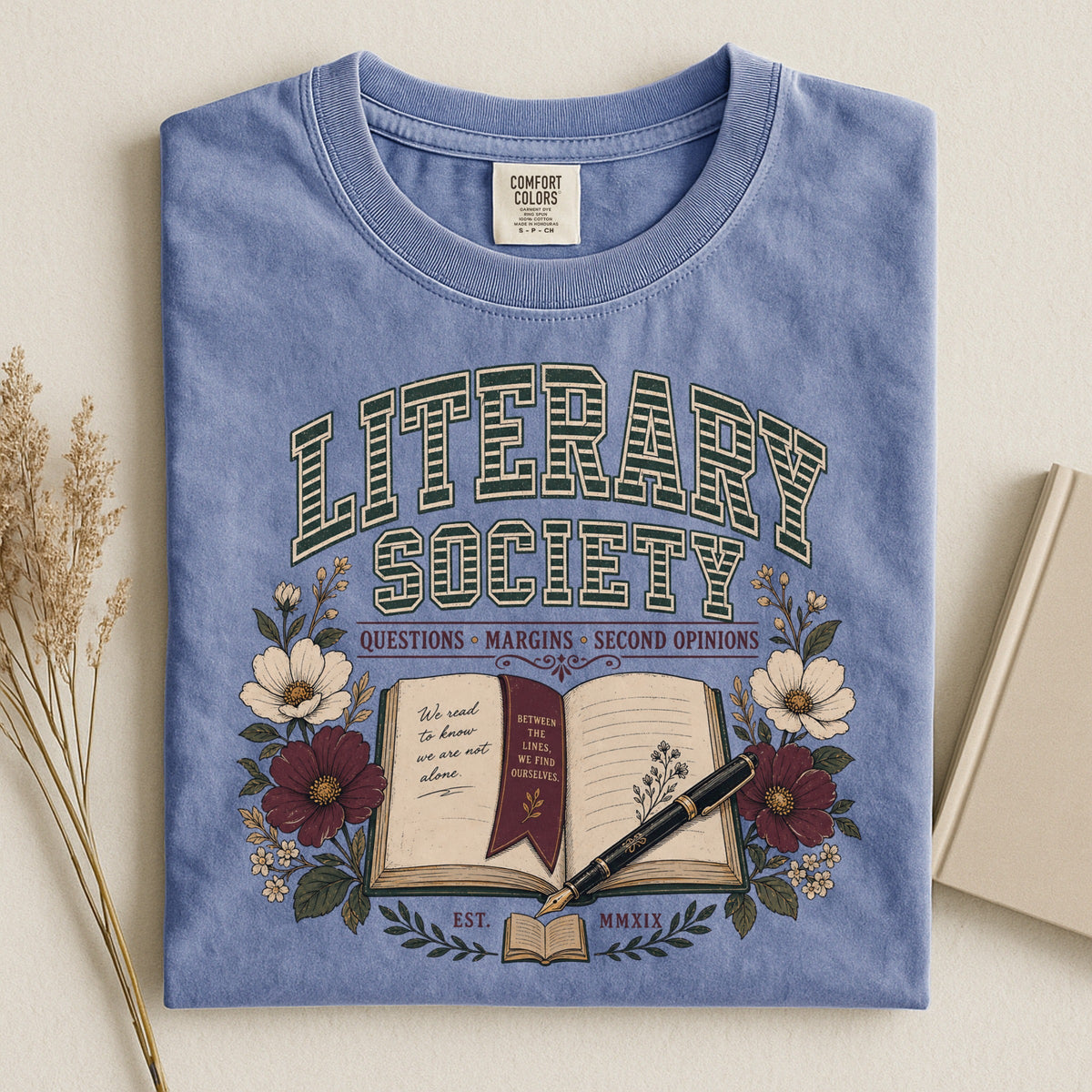 Shelf Love Studio Literary Society t-shirt in Blue Jean, styled flat lay
