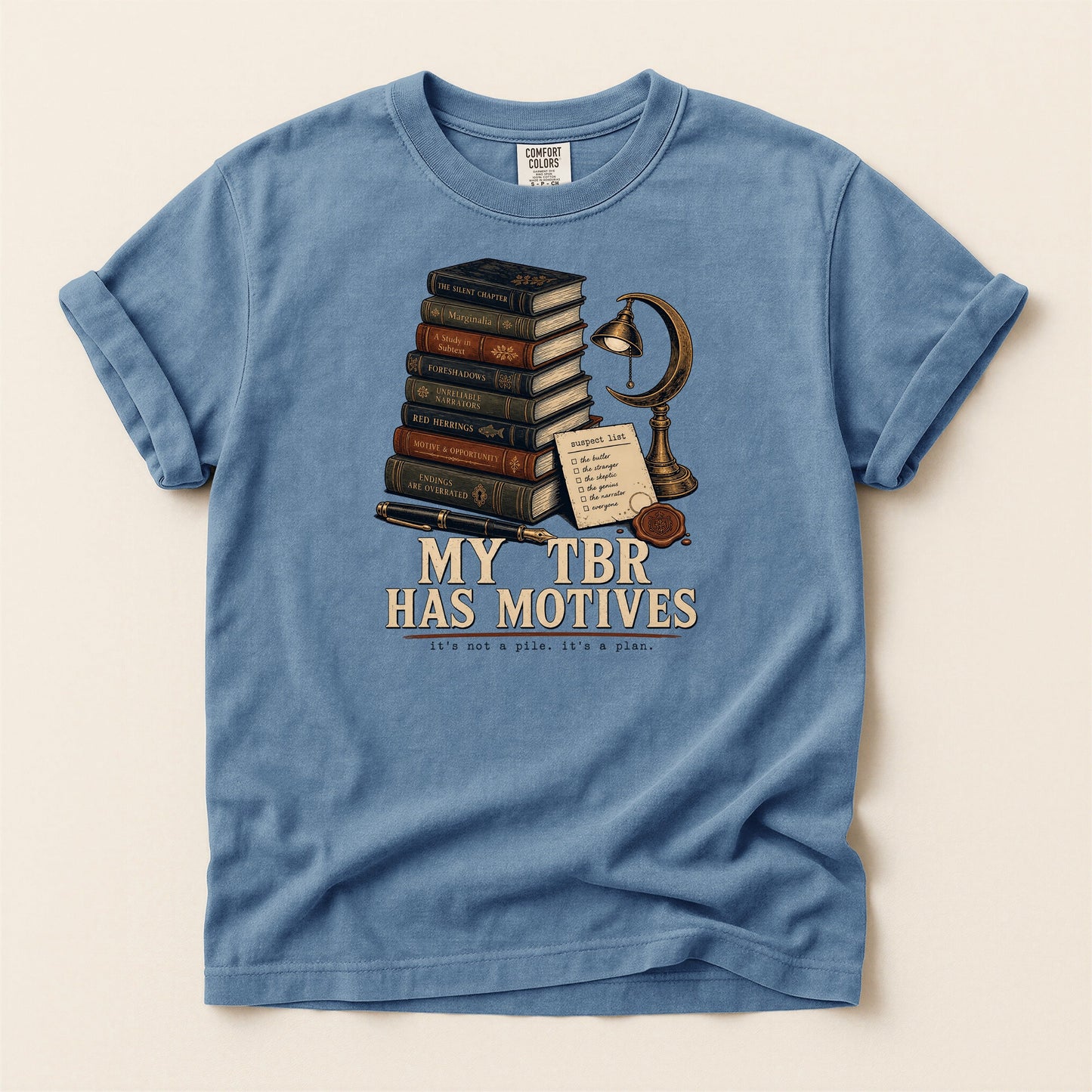 My TBR Has Motives bookish tee in Blue Jean, full flat
