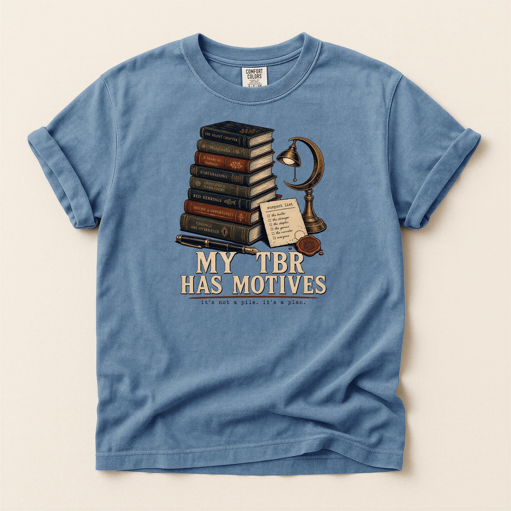 My TBR Has Motives bookish tee in Blue Jean, full flat