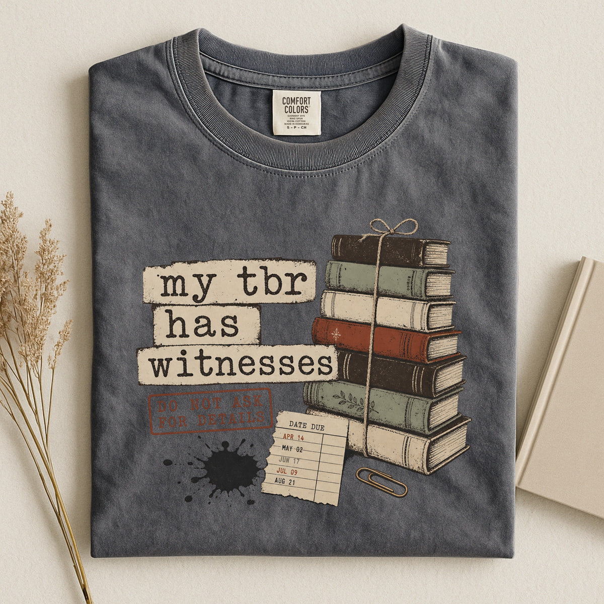 Shelf Love Studio My TBR Has Witnesses t-shirt in Pepper, styled flat lay