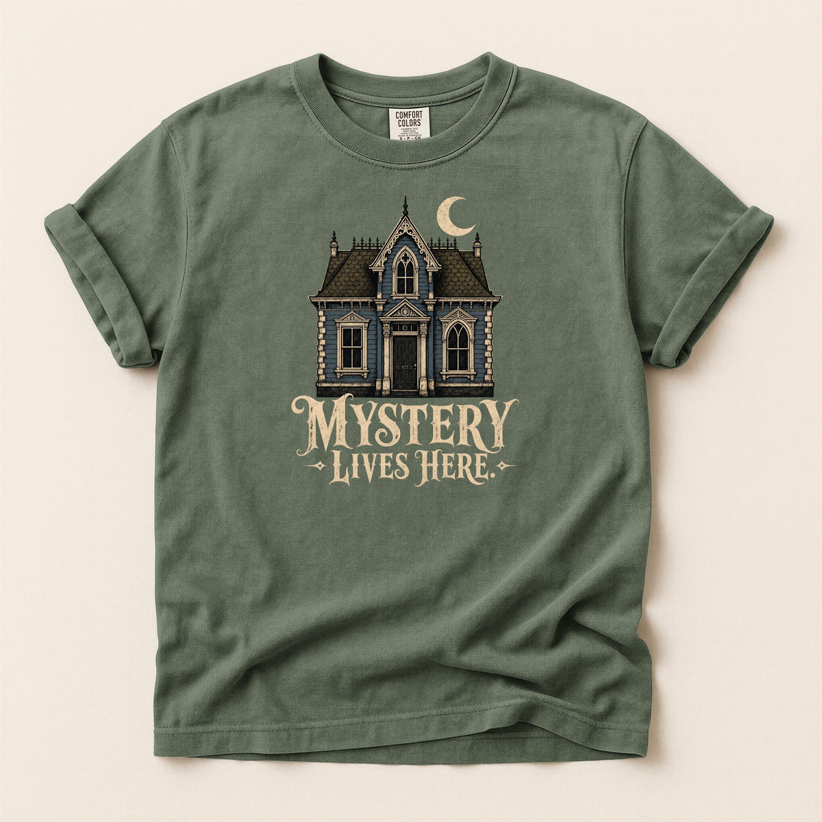 Shelf Love Studio Mystery Lives Here t-shirt in Moss, flat