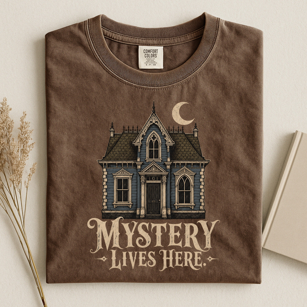 Shelf Love Studio Mystery Lives Here t-shirt in Espresso, styled flat lay