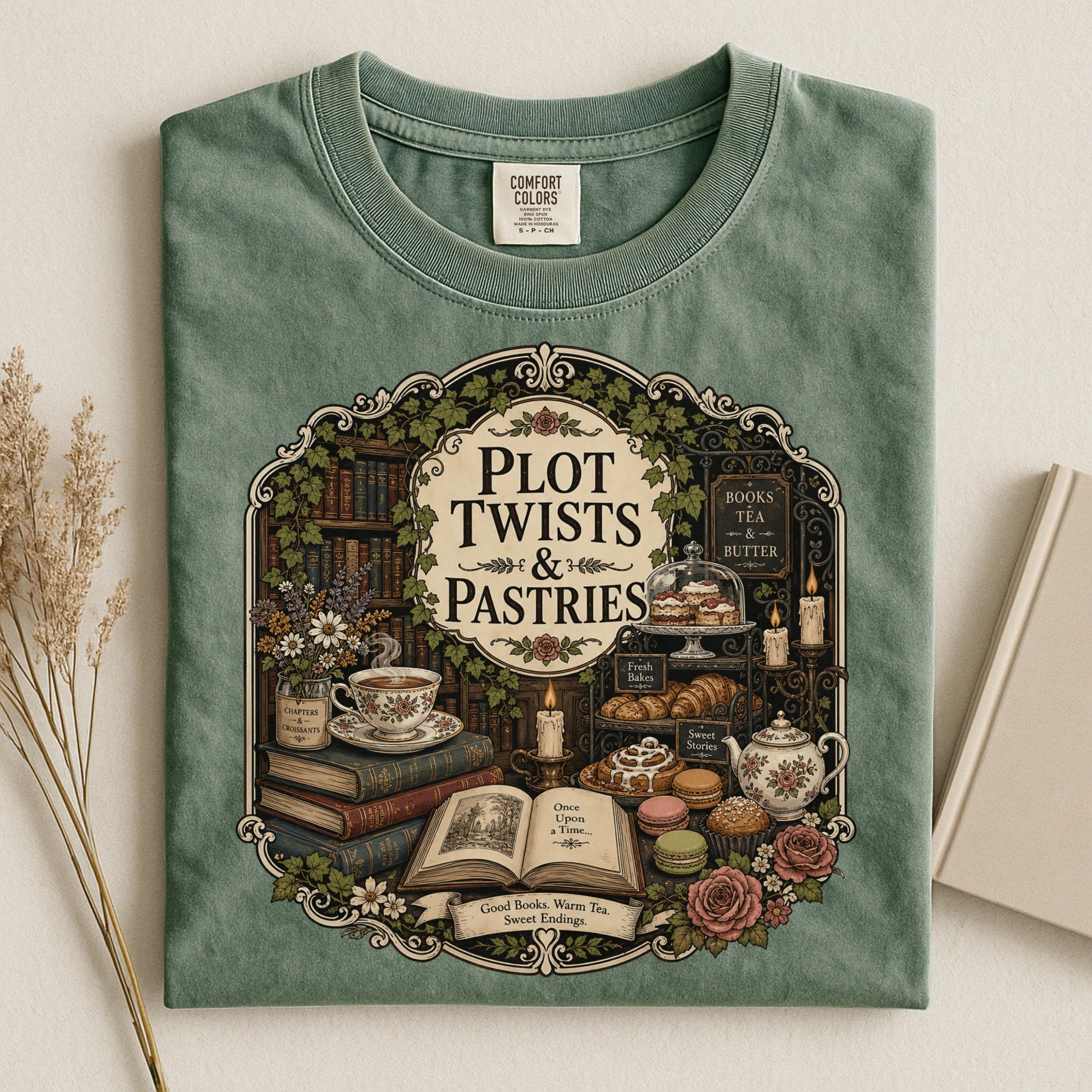 Plot Twists and Pastries bookish tee in Moss, flat lay