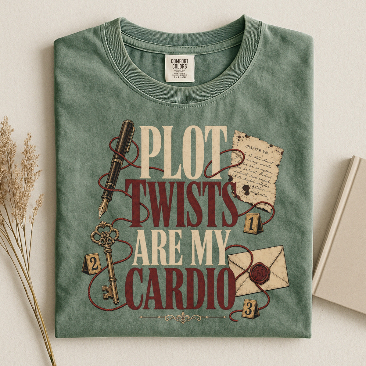 Shelf Love Studio Plot Twists Are My Cardio t-shirt in Moss, styled flat lay