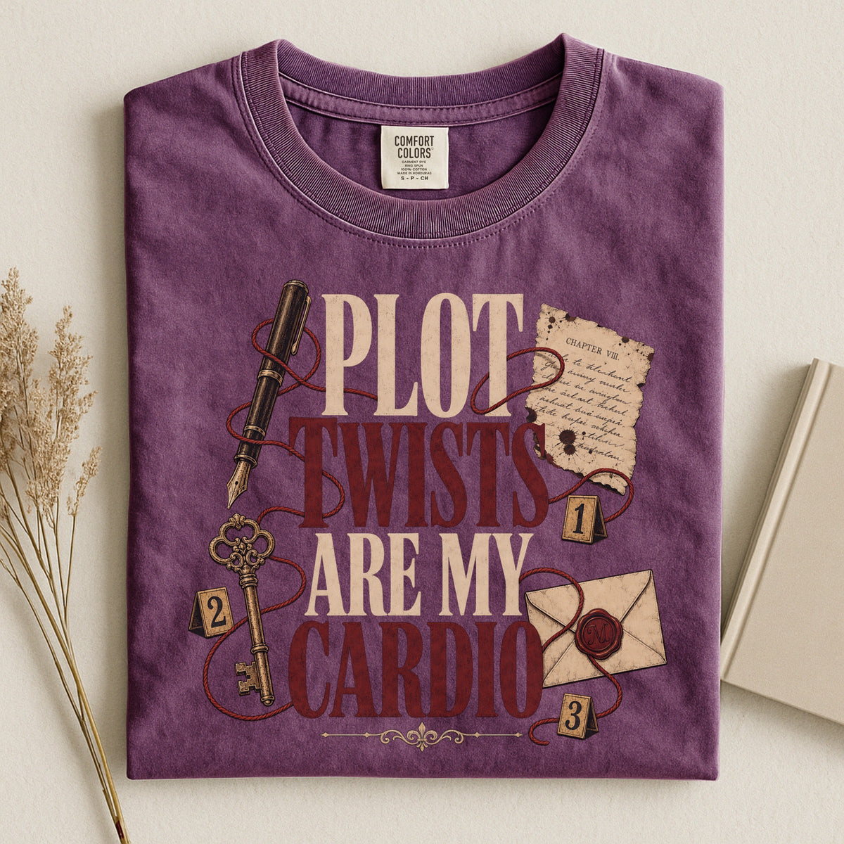 Shelf Love Studio Plot Twists Are My Cardio t-shirt in Berry, styled flat lay