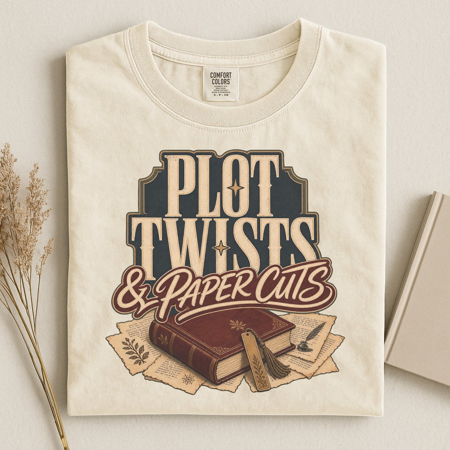 Plot Twists & Paper Cuts bookish tee in Ivory, flat lay