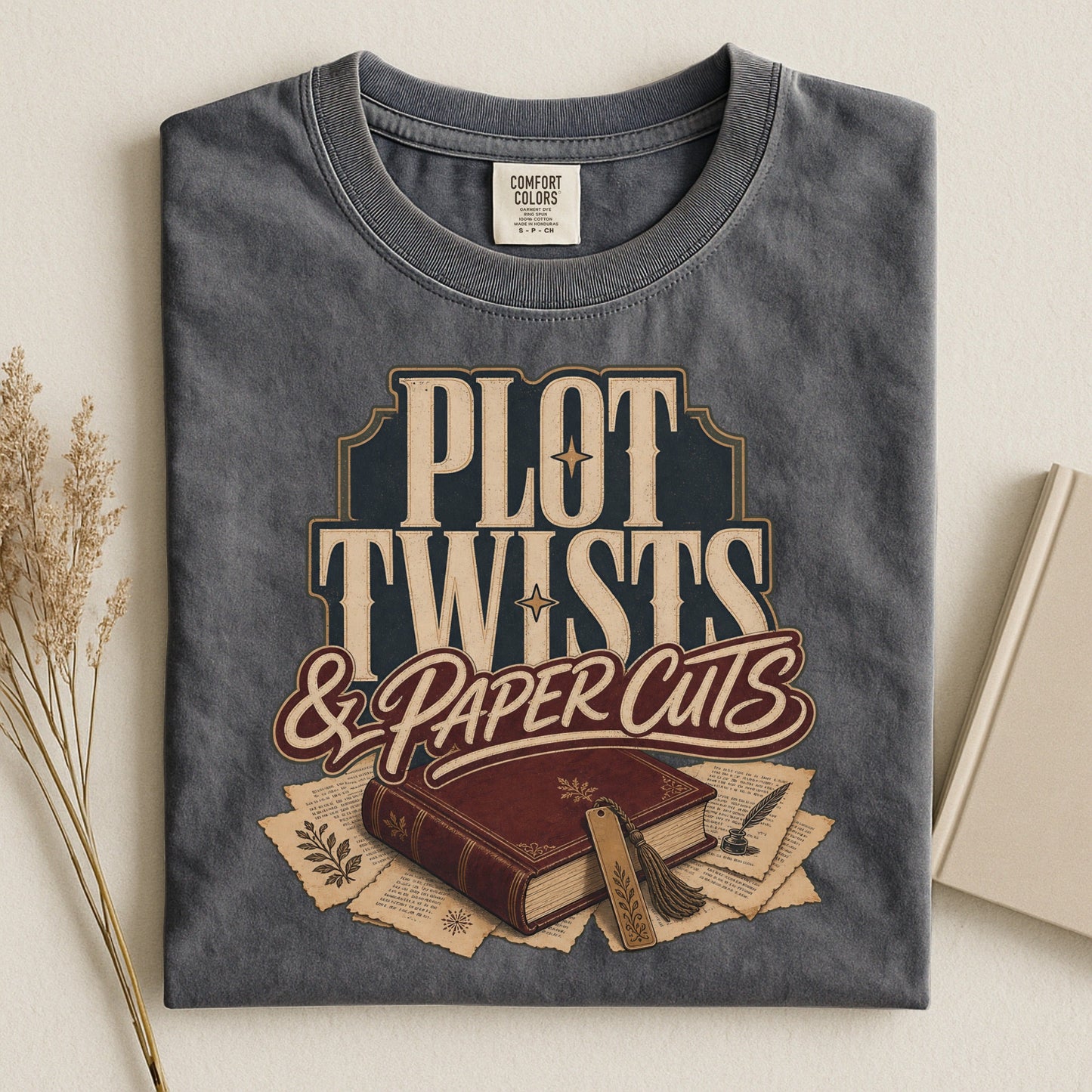 Plot Twists & Paper Cuts bookish tee in Pepper, flat lay