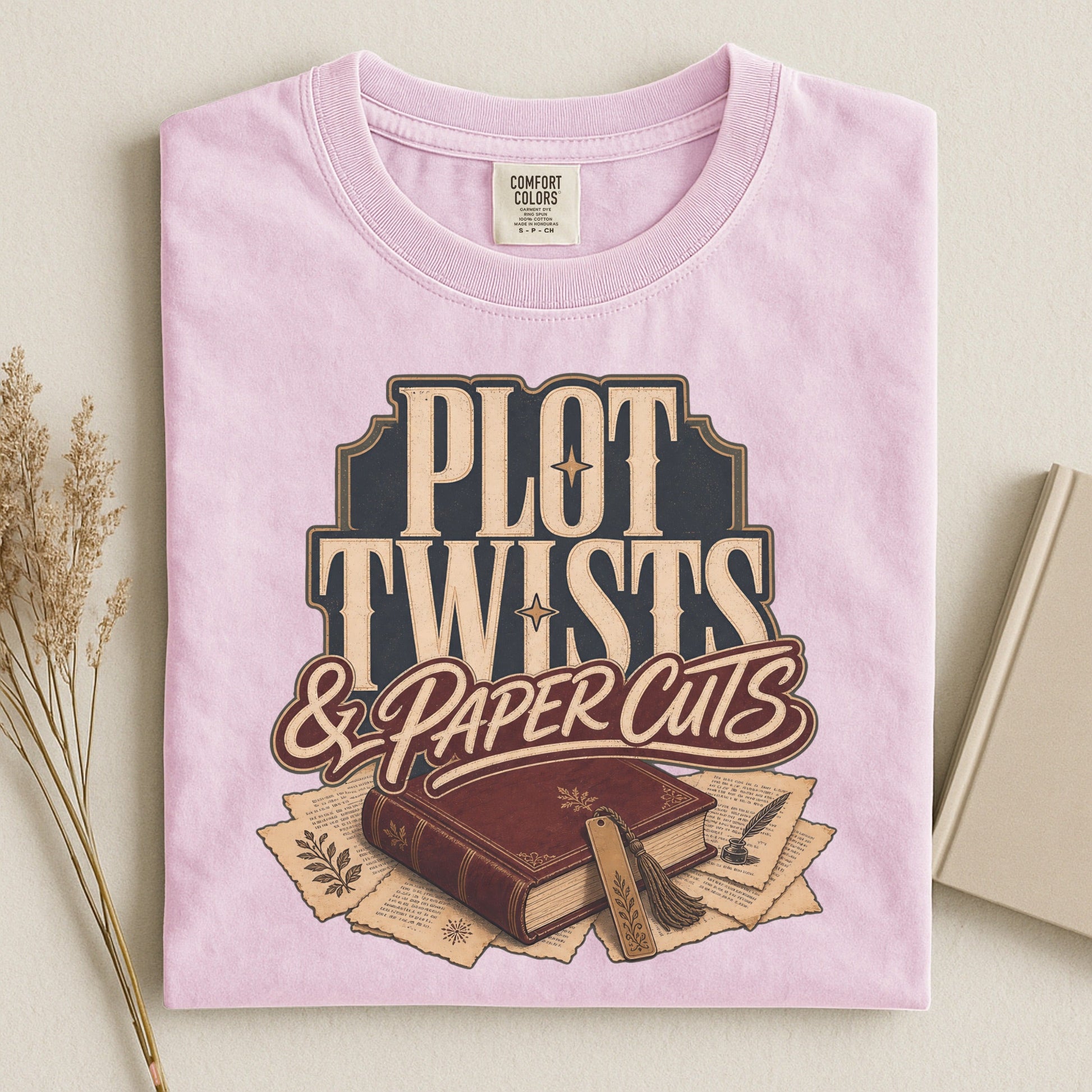 Plot Twists & Paper Cuts bookish tee in Blossom, flat lay