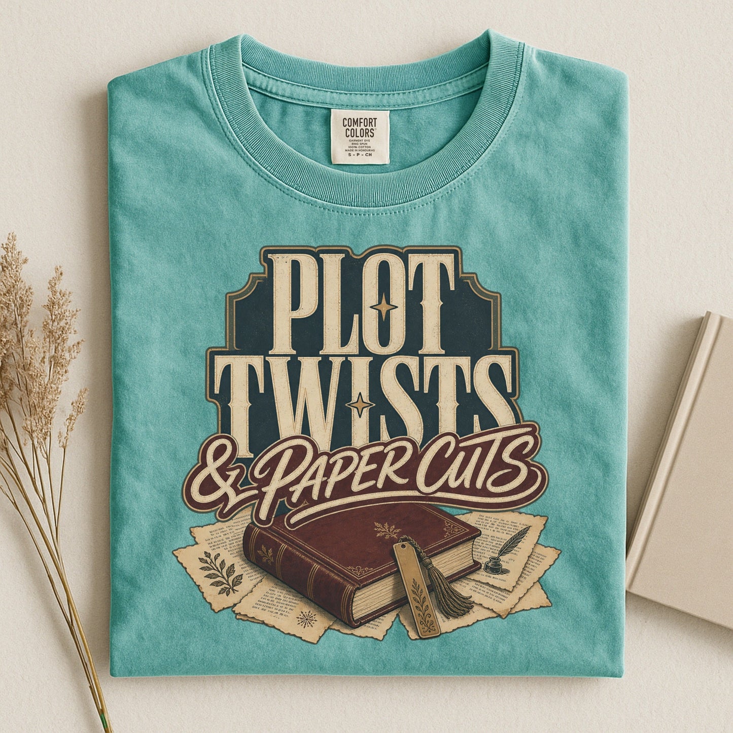 Plot Twists & Paper Cuts bookish tee in Seafoam, flat lay