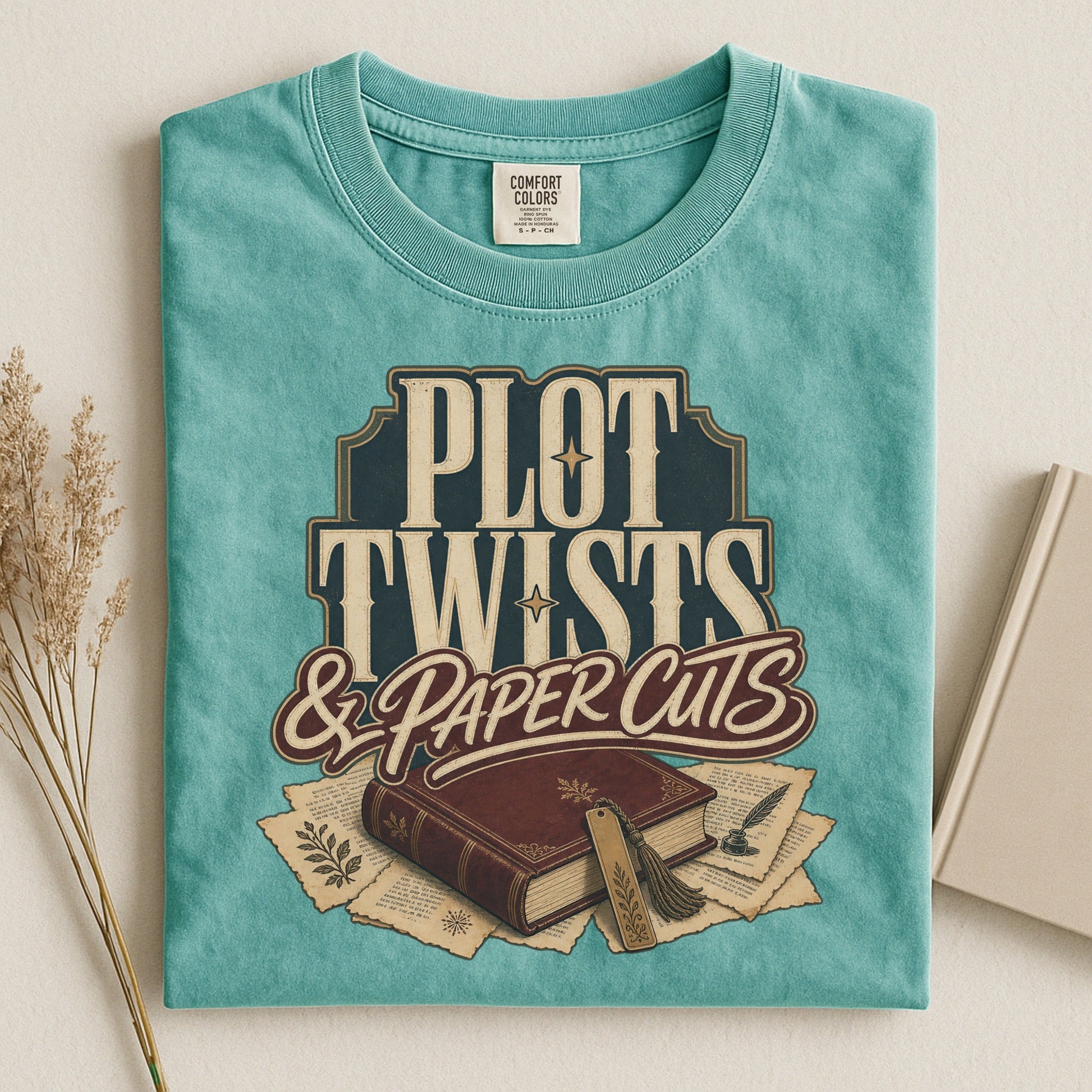 Plot Twists & Paper Cuts bookish tee in Seafoam, flat lay