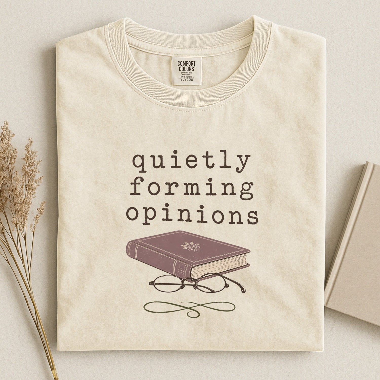 Quietly Forming Opinions bookish tee in Ivory, flat lay